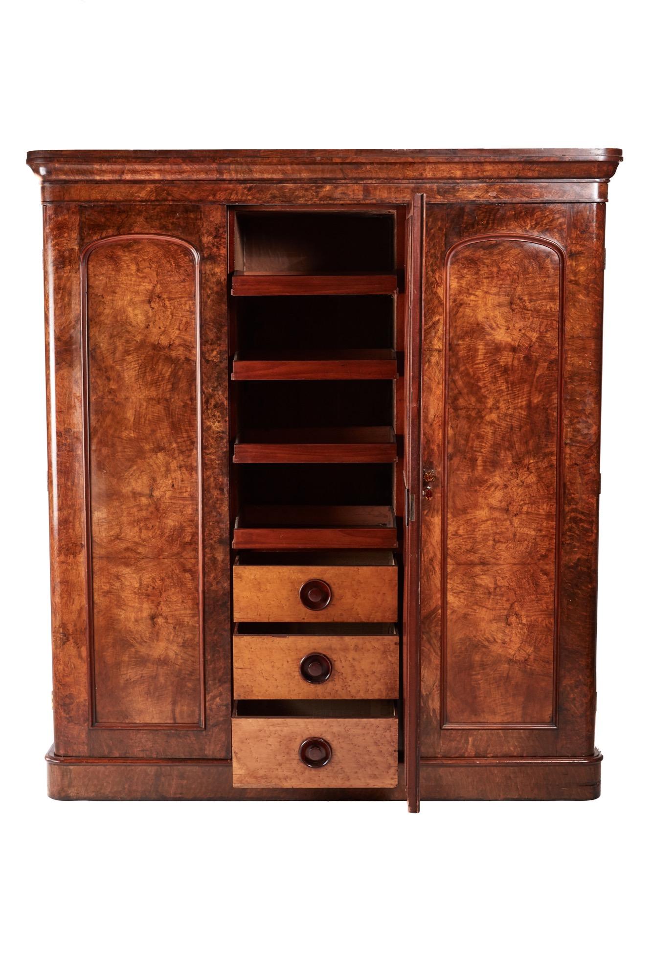 Quality Victorian burr walnut wardrobe having a shaped cornice, two lovely burr walnut panelled doors and one mirror door, opens to reveal a lovely bird's-eye maple fitted interior of drawers and sliding trays, standing on a plinth base
Lovely