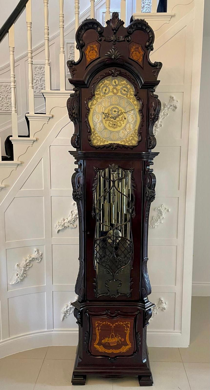 Extremely large exhibition quality antique Victorian carved mahogany and marquetry tubular chiming long case clock having an impressive carved mahogany and marquetry inlaid case with fantastic carved pierced fretwork to the glass door, 14 inch