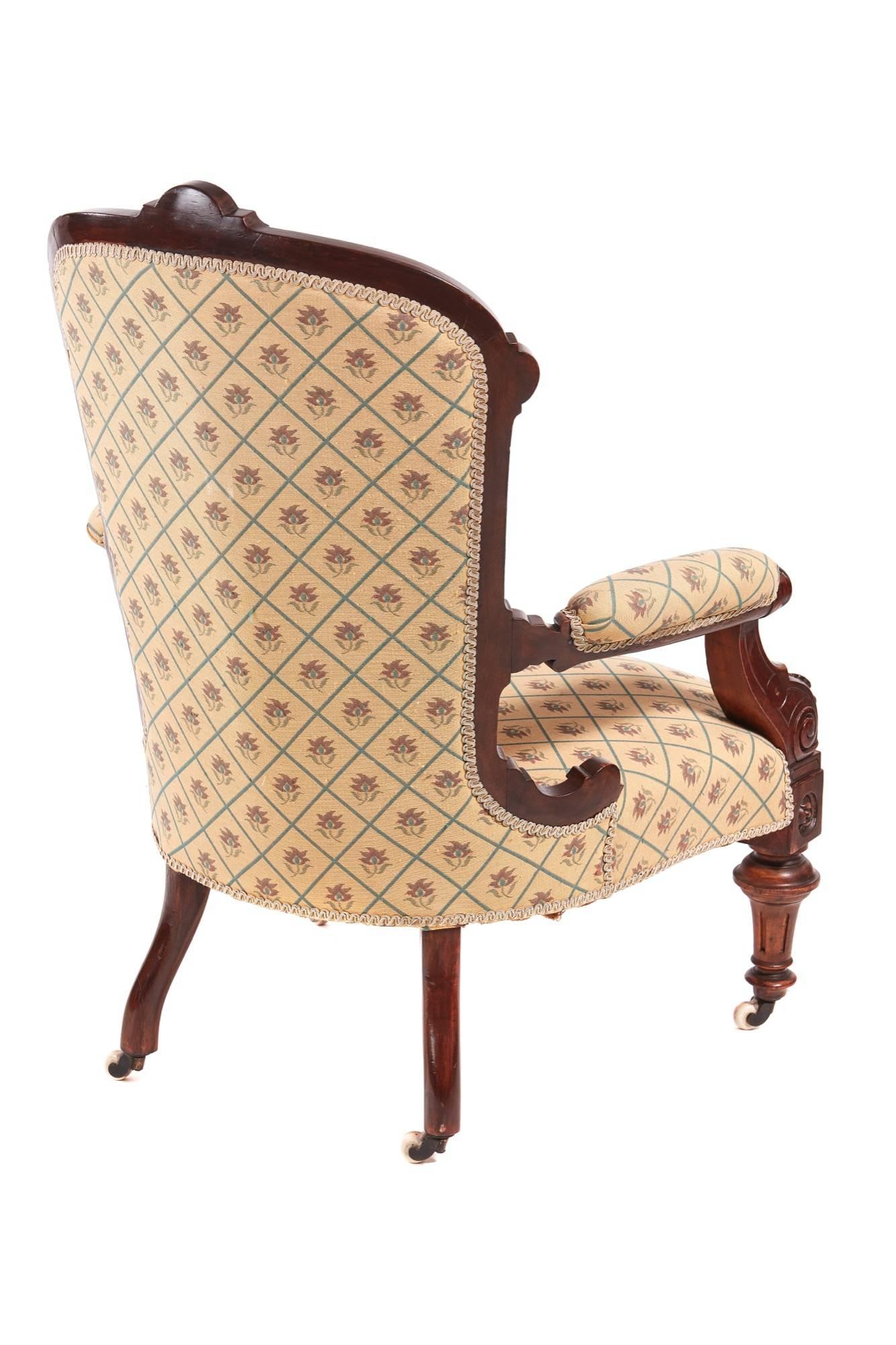 Quality Victorian carved walnut turned leg armchair, with a walnut framed back carved top rail lovely carved open arms turned reeded legs to the front outswept back legs, original castors.