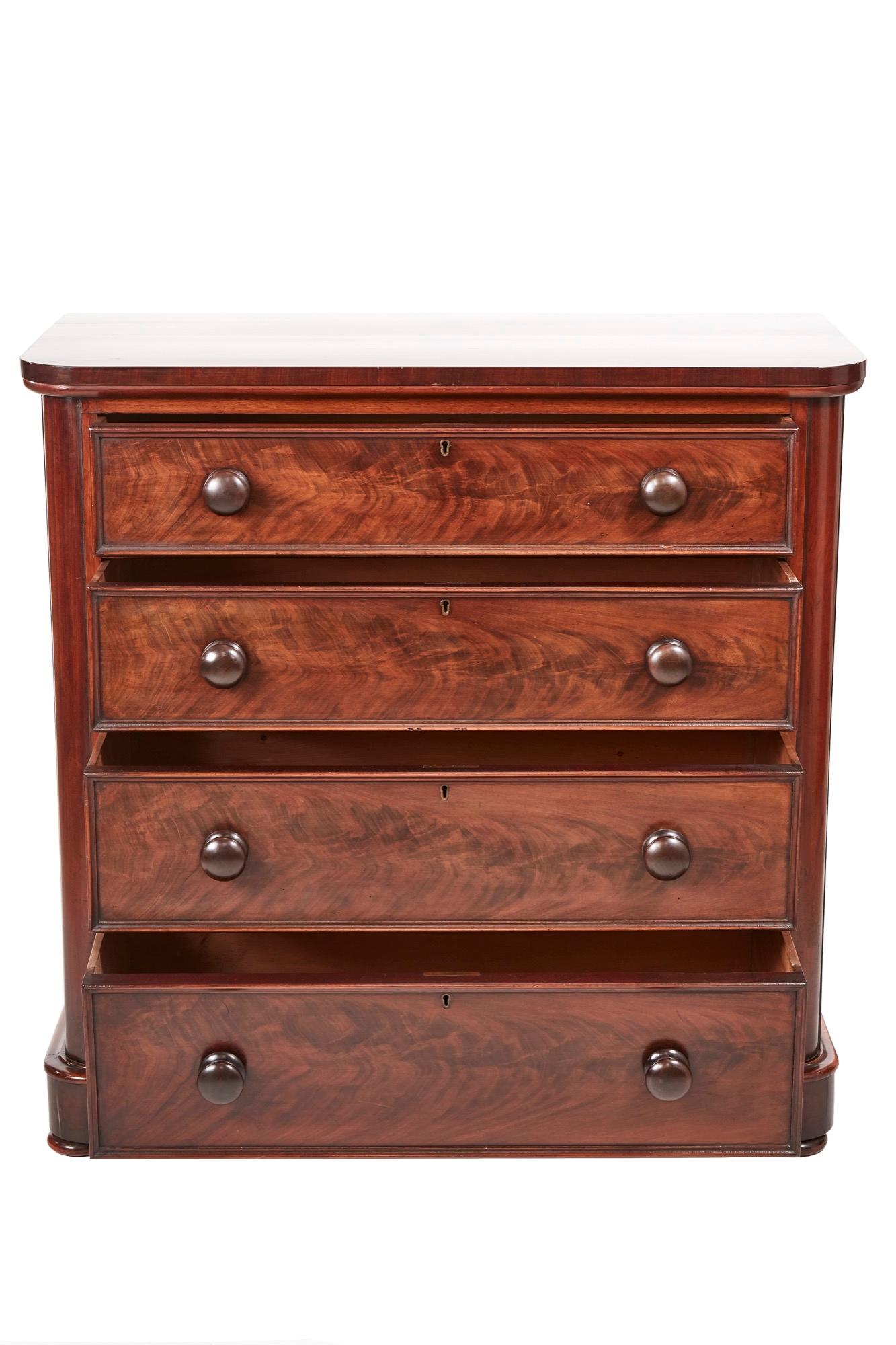 Quality Victorian mahogany chest of drawers, having a lovely mahogany top, four long mahogany drawers with original turned mahogany knobs, lovely molded drawer fronts, standing on a plinth base, original bun feet
Lovely color and