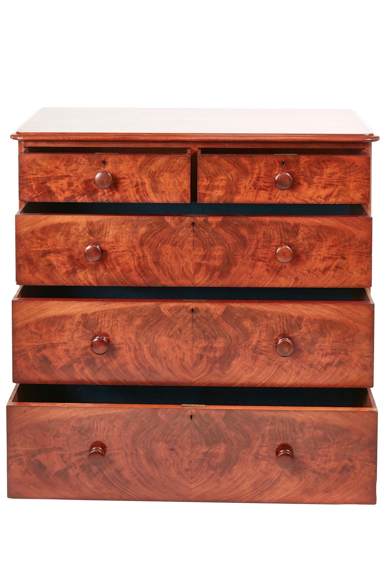 Quality Victorian mahogany chest of drawers, having a lovely quality top with a thumb moulded edge, two short and three long drawers with original mahogany turned knobs, standing on a plinth base with turned feet
Fantastic color and