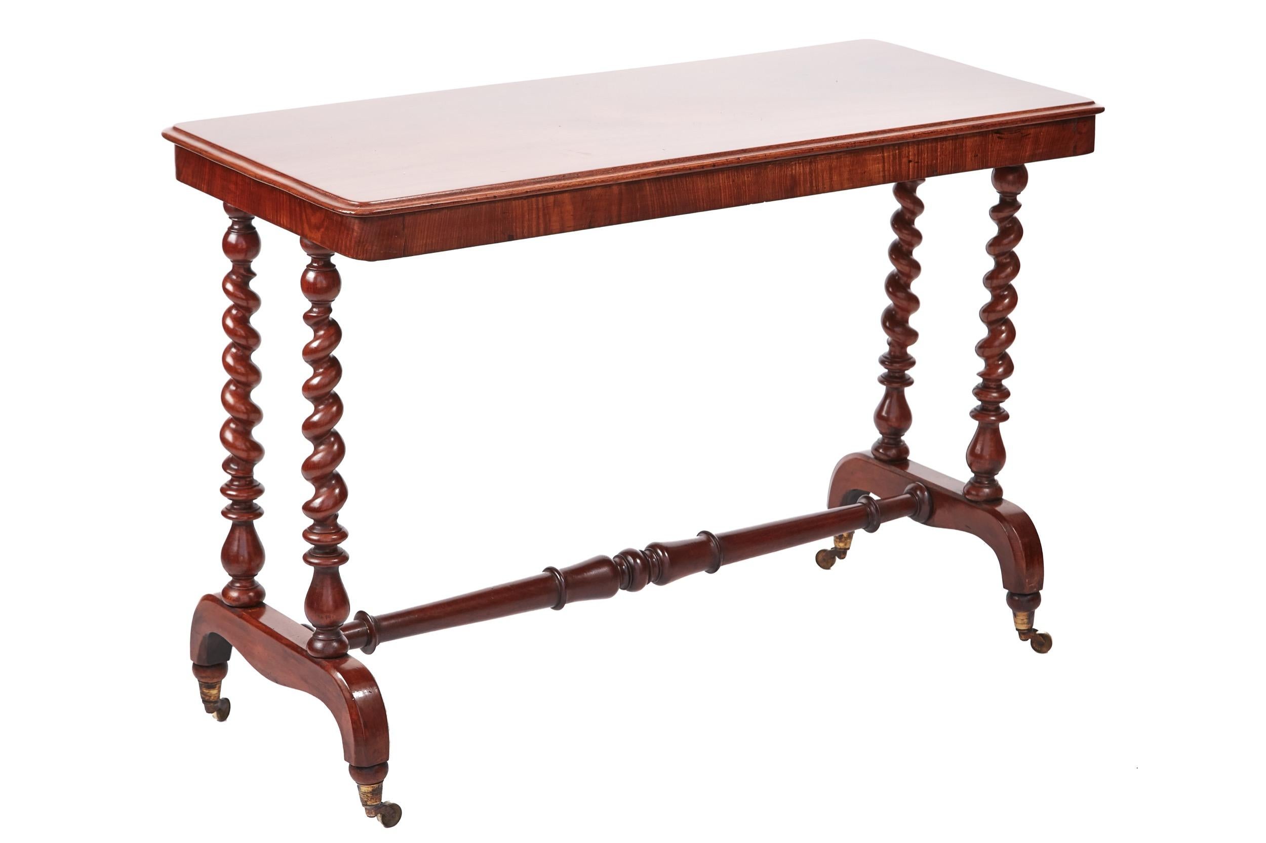 Quality victorian mahogany side table, having a lovely quality mahogany top with a thumb moulded edge,supported by four solid mahogany barley twist columns,standing on shaped ends with original brass castors, united by a solid mahogany turned