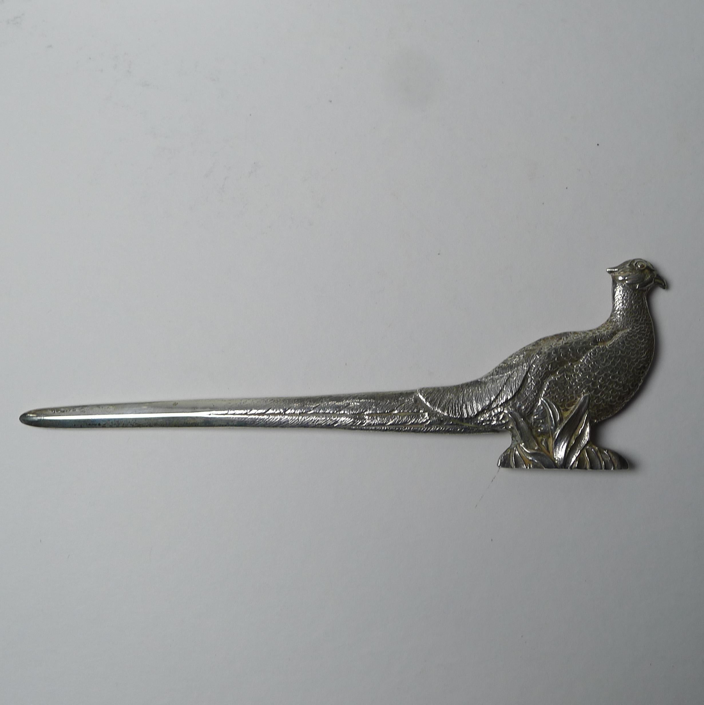A stunning, beautifully cast letter opener in solid English Sterling silver with a hefty weight of 98.5 Grams / 3 17 Troy Ounces.

The handle features a wonderful Pheasant and the silver is fully hallmarked for London 1962, so 60 years old; the