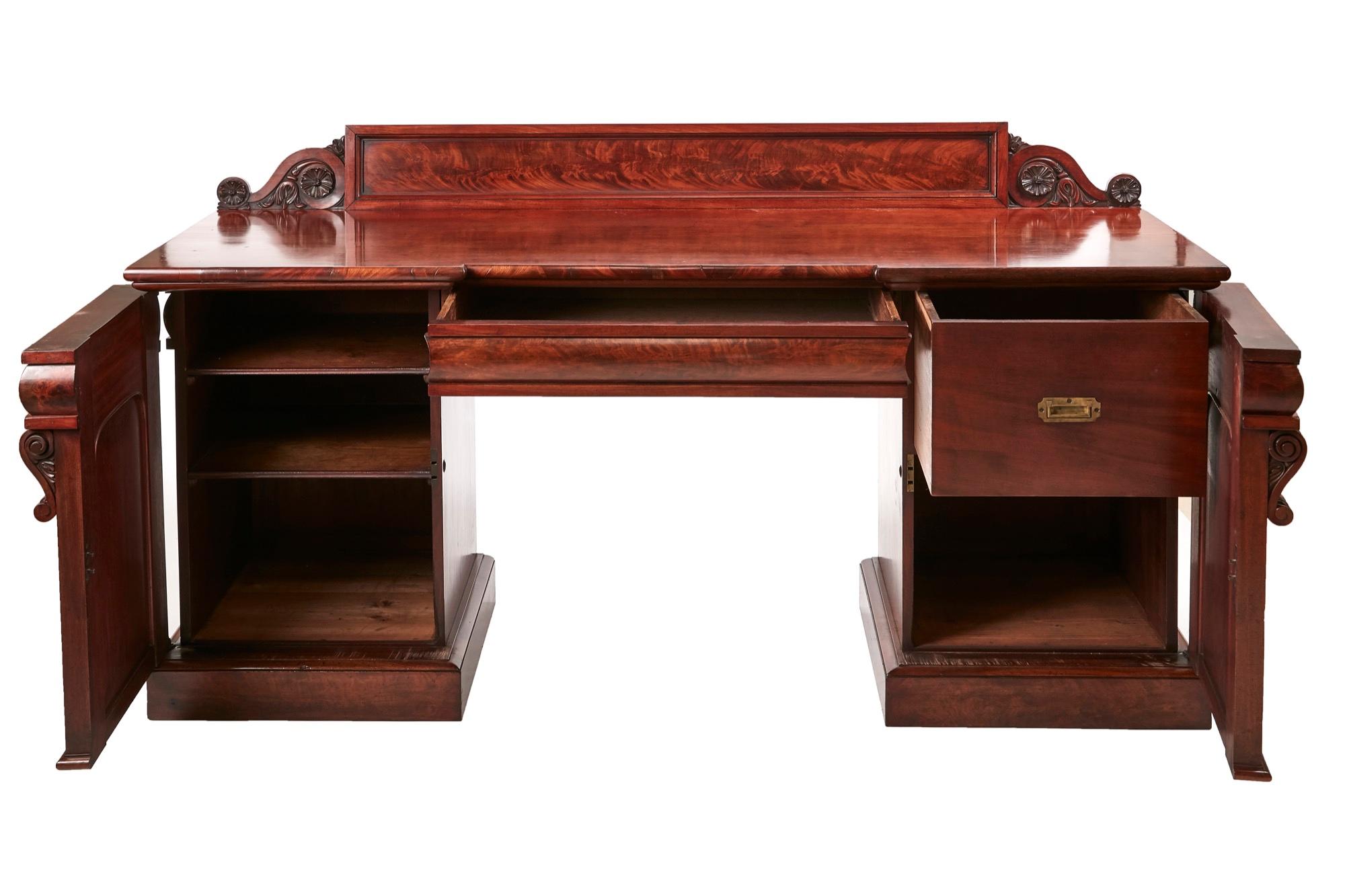 Quality William IV carved mahogany sideboard, having a lovely low carved mahogany back,quality mahogany top,one shaped drawer to the frieze, supported by two pedestals with quality carvings, fitted interior, standing on a plinth base.
Lovely color
