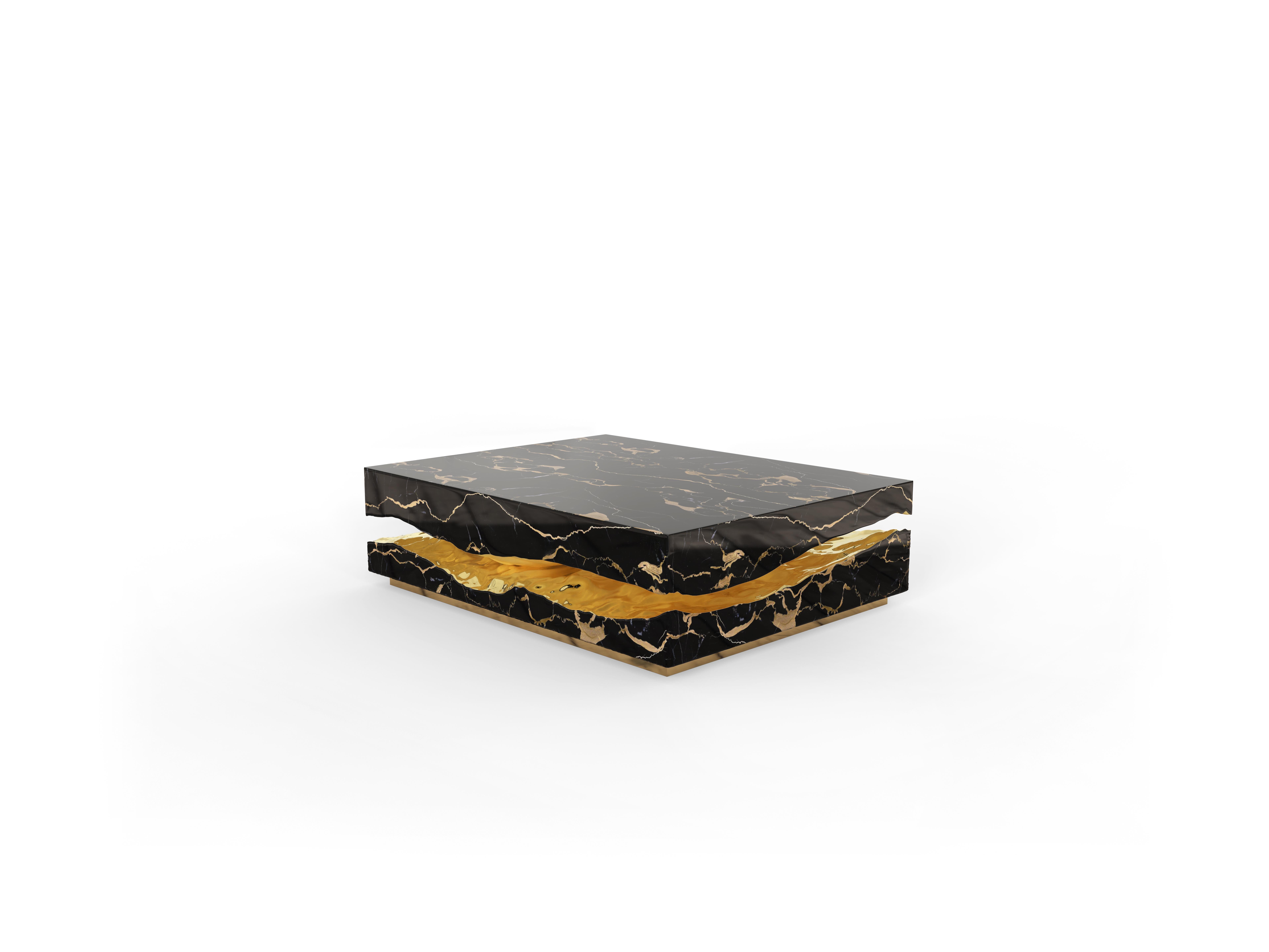 The Quarry Center Table takes exceptional craftsmanship and design to a new level of sophistication. Inspired by raw stone's natural forms and beauty, this coffee table is a celebration of organic elegance. Made from Portoro marble, its surface