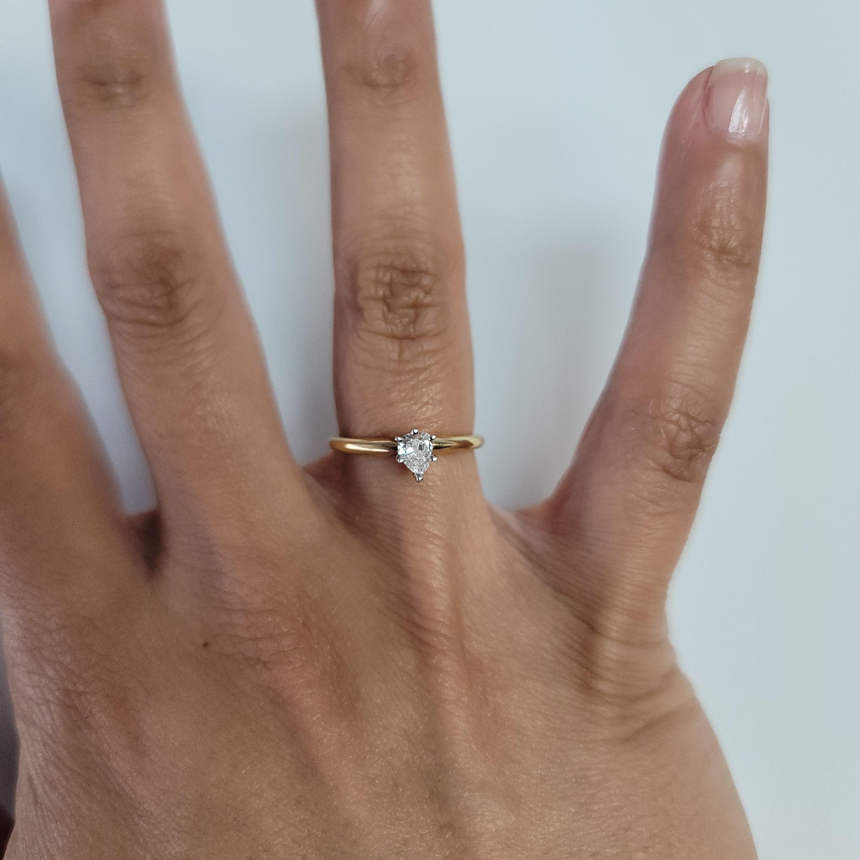 ♥ Product Summary ♥

Main Stone: Diamond
Approx. Diamond Carat Weight: .25cttw
Diamond Clarity: SI1
Diamond Color: G
Diamond Cut: Pear
Prong Material: 14k White Gold
Dimensions: 6mm x 5mm
Band Material: 14k Yellow Gold
Setting: Six-Prong
Size: