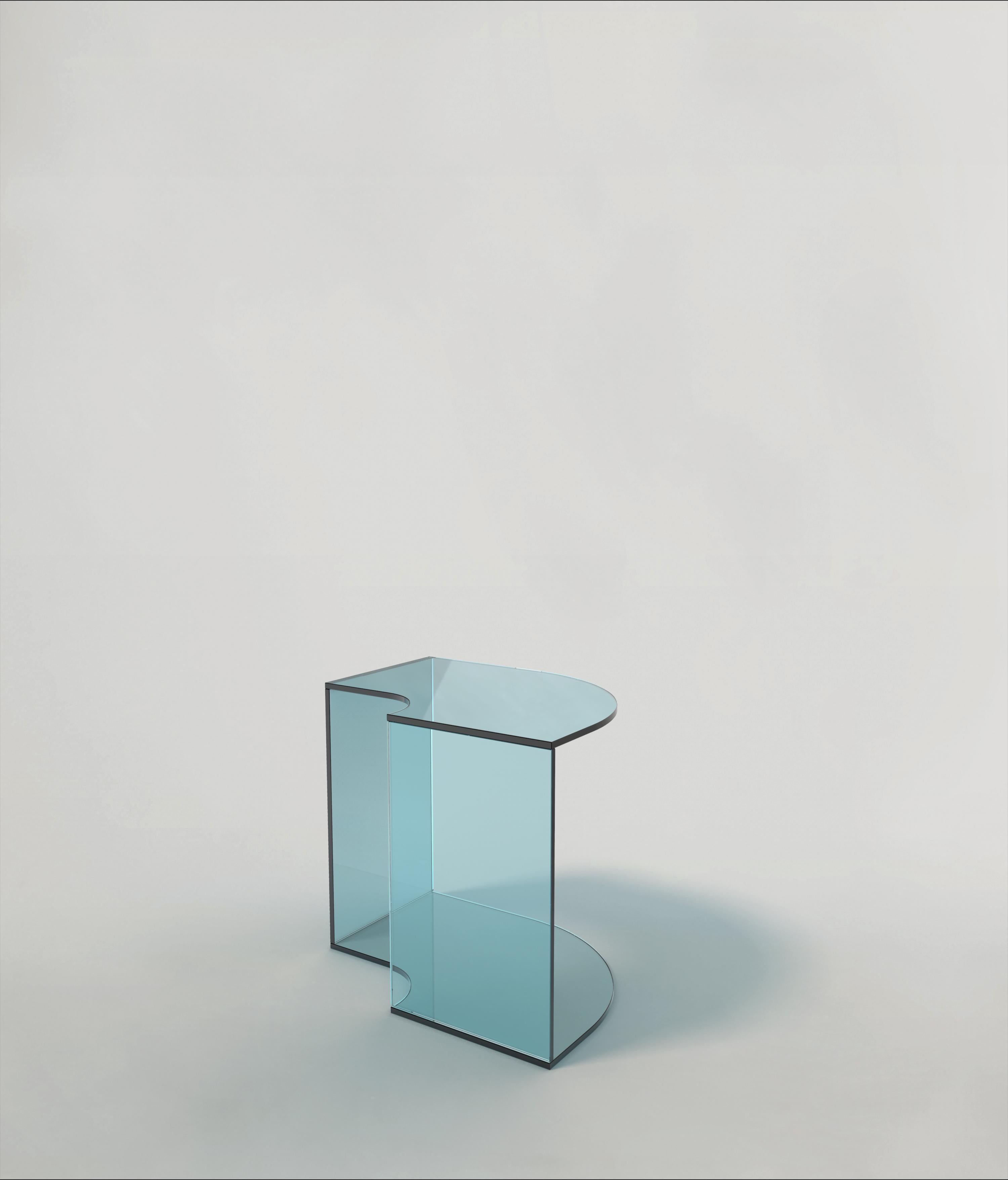 Quarter V1 side table by Edizione Limitata
Limited Edition of 1000 pieces. Signed and numbered.
Dimensions: D 45 x W 35 x H 41 cm
Materials: blue finish shiny glass,

Quarter is a collection of contemporary side tables made by Italian artisans in