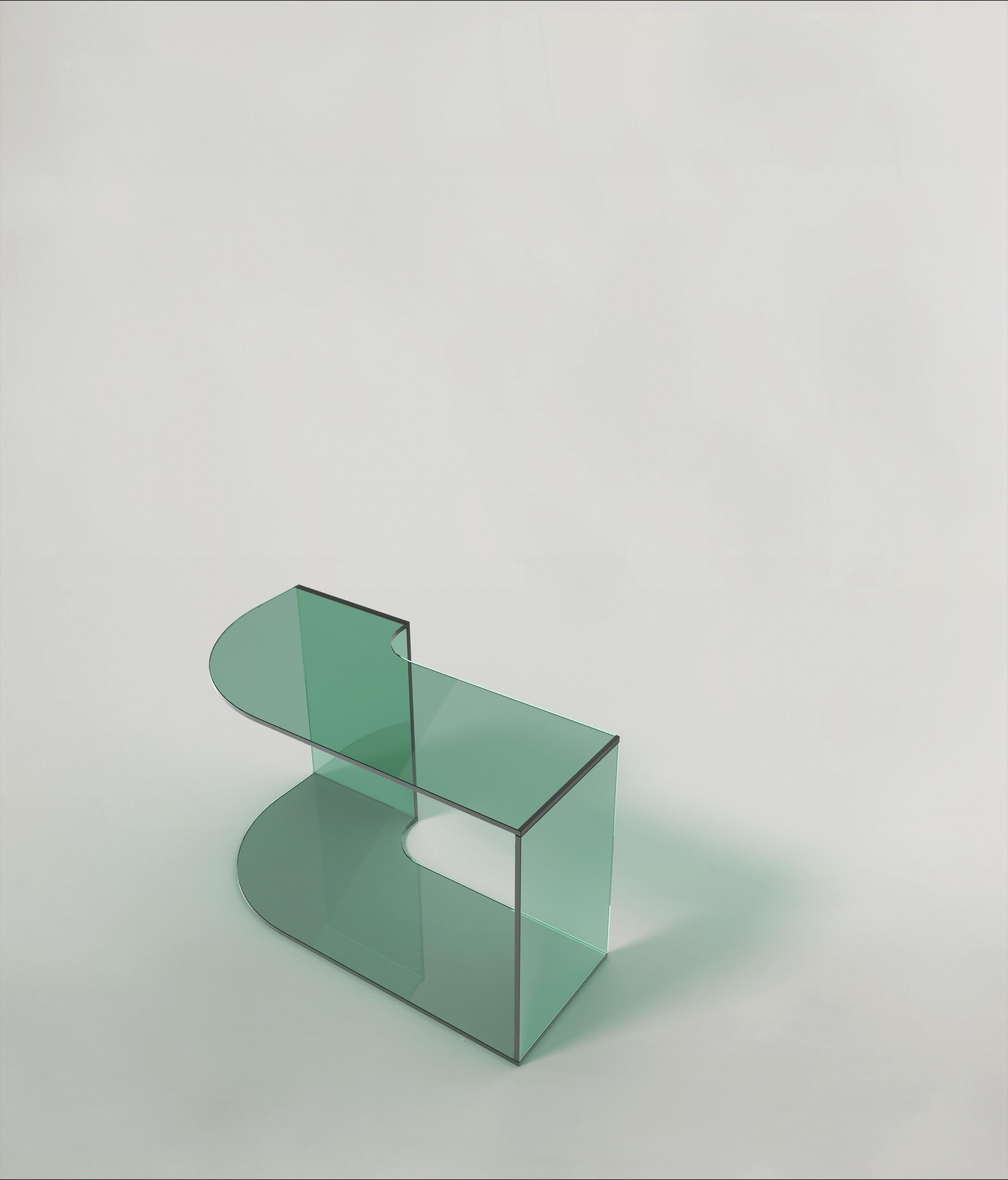 Quarter V2 coffee table by Edizione Limitata
Limited Edition of 1000 pieces. Signed and numbered.
Dimensions: D70 x W35 x H41 cm
Materials: Green Shiny Glass

Quarter is a collection of contemporary side tables made by Italian artisans in colored