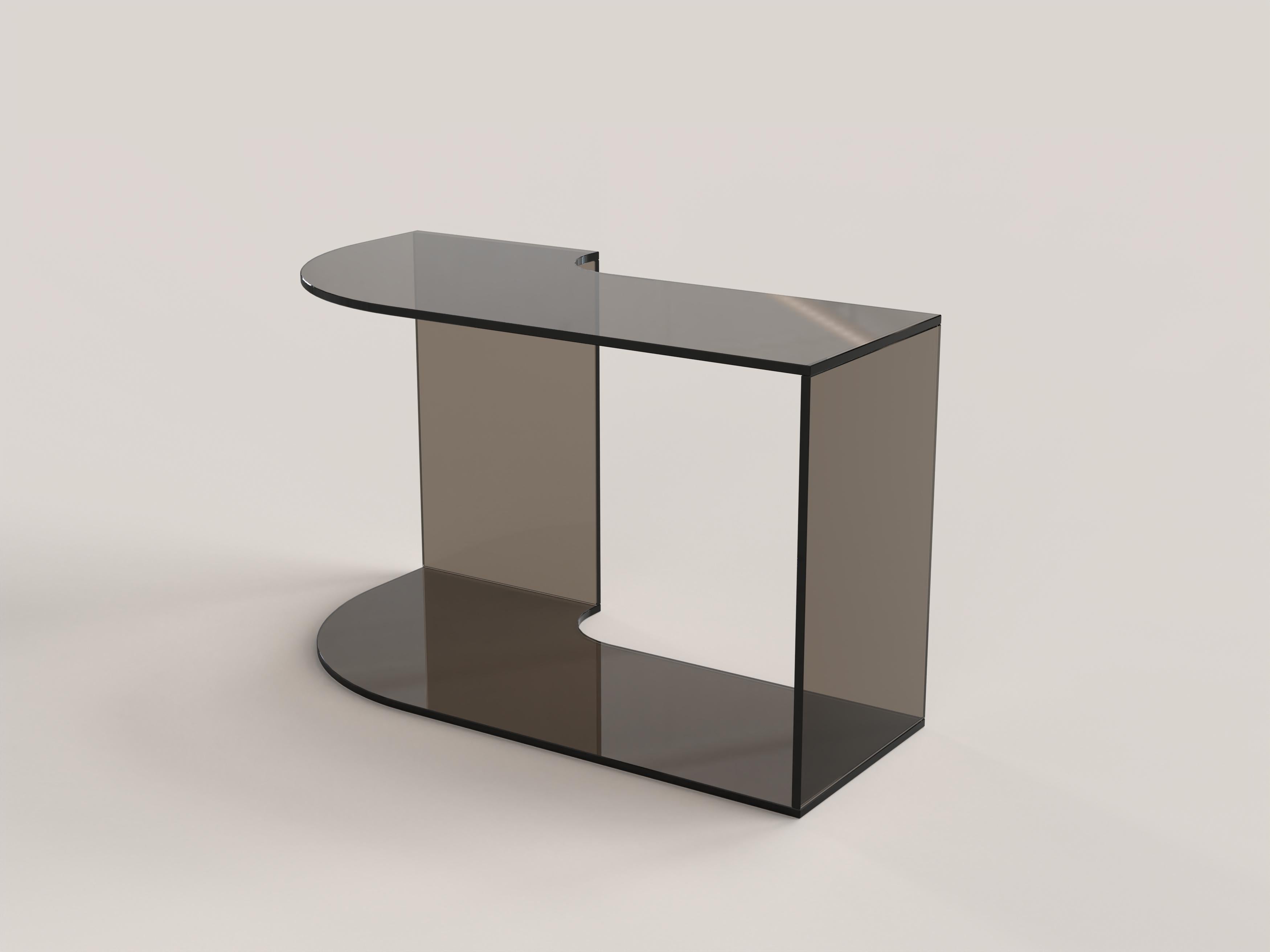 Quarter V2 Coffee Table by Edizione Limitata
Limited Edition of 1000 pieces. Signed and numbered.
Dimensions: D 70 x W 35 x H 41 cm.
Materials: Bronzed tempered glass.

Quarter is a collection of contemporary side tables made by Italian artisans in