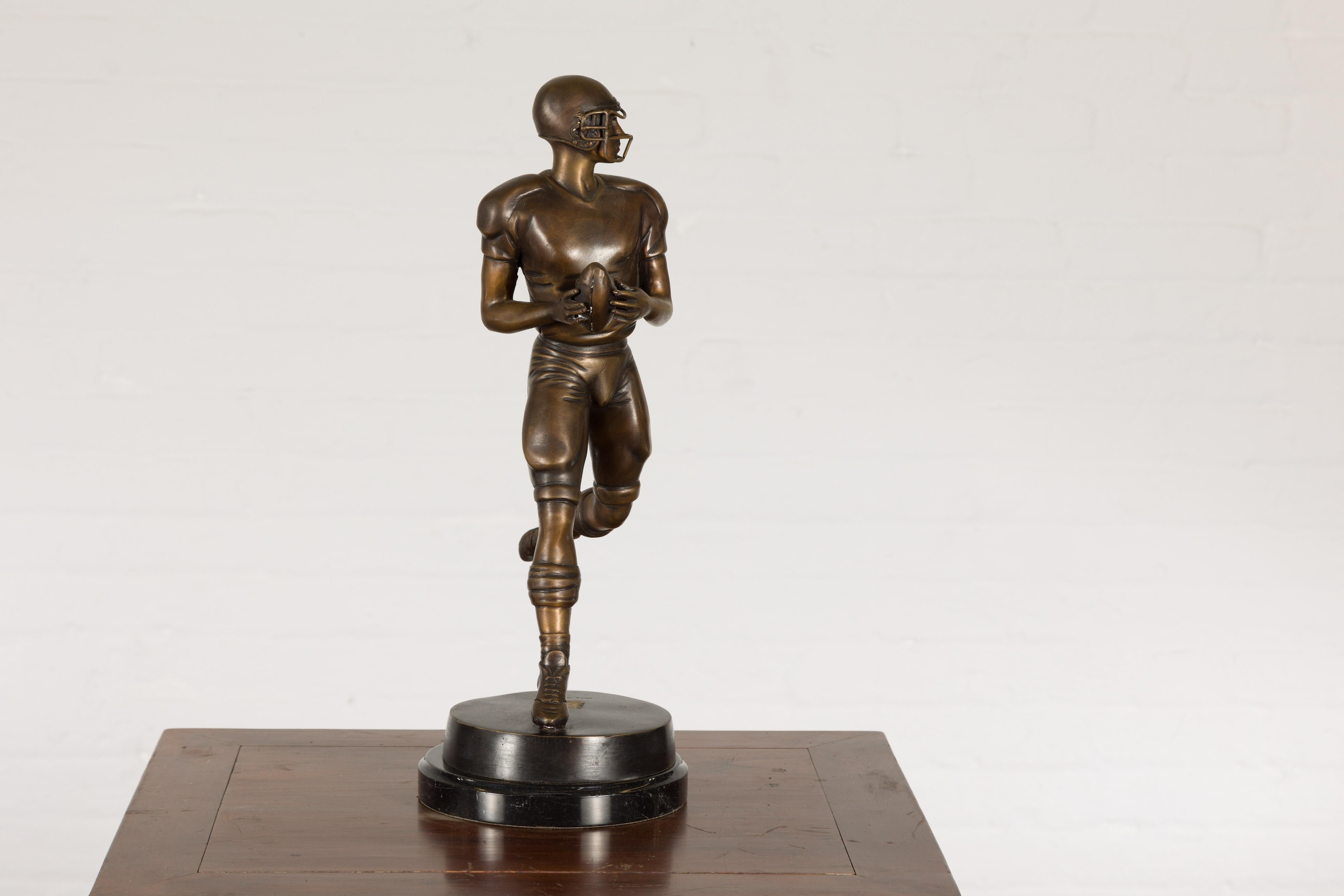 bronze football statue
