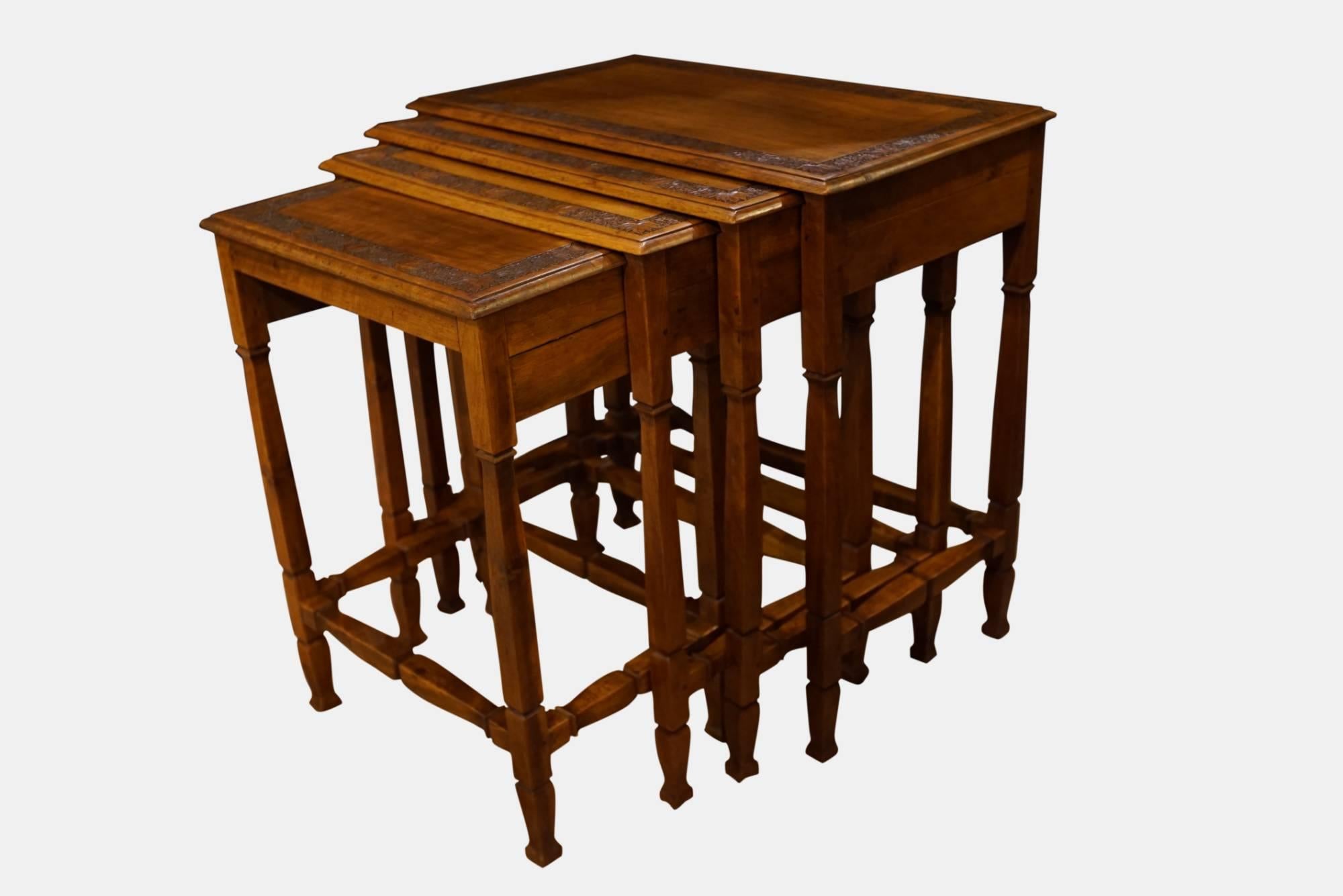Quartetto nest of tables

Walnut, carved with running leaf pattern raised on square baluster legs

Continental, circa 1900.
 