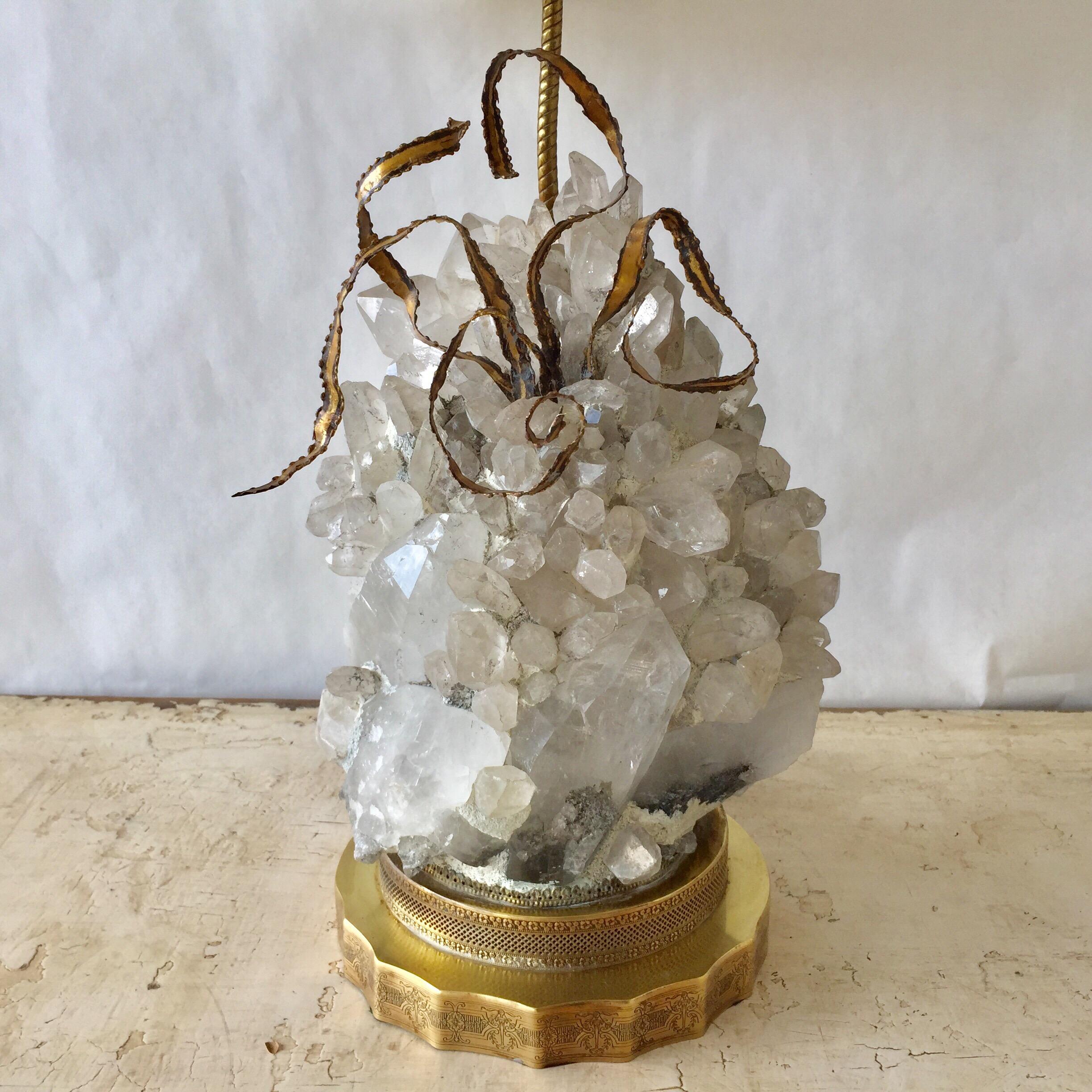 Arrangement of rock crystal quartz and brass plant elements on brass base which is intricately etched. This lamp is from the 1940s. All original and newly rewired. Never seen one like this before - very rare! 

Note: Quartz piece is 12 inches