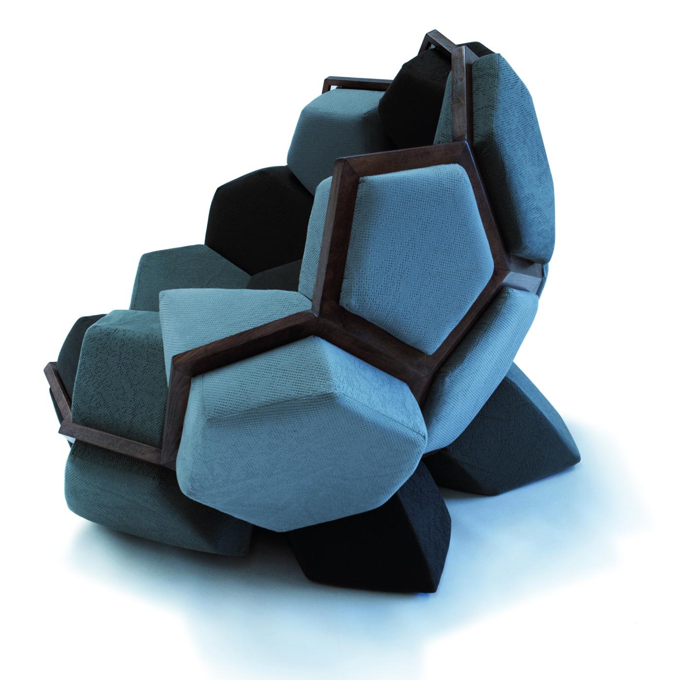 A striking display of Italian design and time-honored artisan skills, this unconventional armchair offers a wraparound seating experience in an eye-catching voluminous and geometric shape that will make a statement in a contemporary interior. The