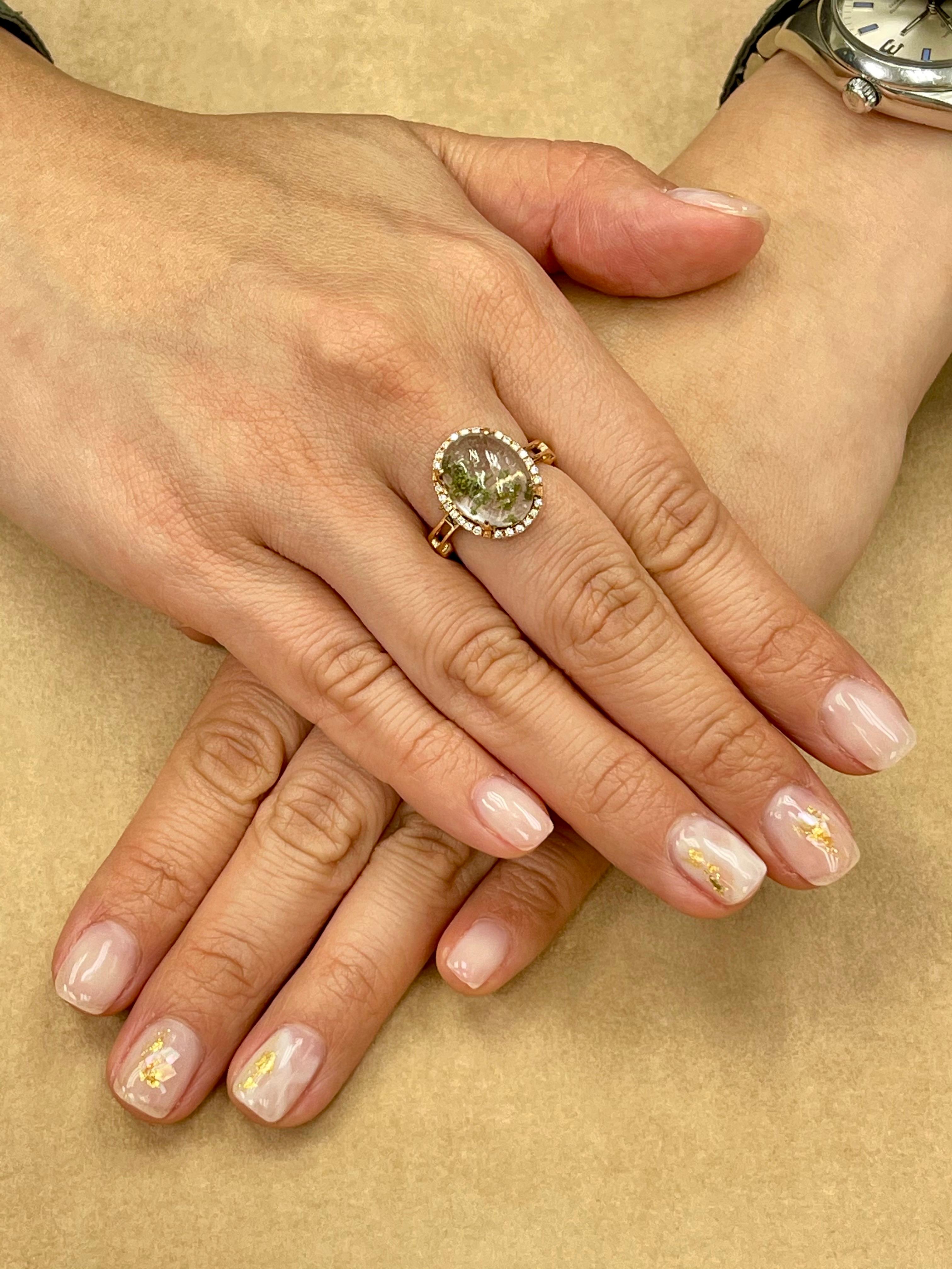 This is a beautiful ring and pendant combination. It is set in 18k rose gold and diamonds. In the center is a natural quartz crystal. It is in the same of a high dome cabochon. The measurements of the quartz are approximately 11x14mm with a 6mm high