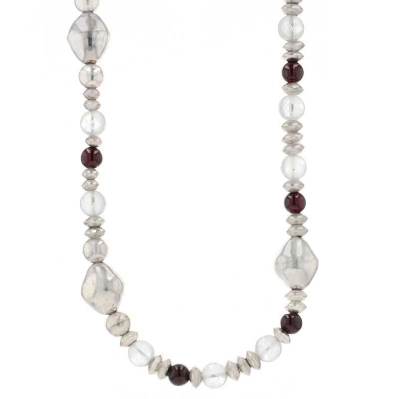 This fine beaded gemstone necklace is sure to become a signature piece in your jewelry collection! This necklace features genuine quartz, genuine onyx, and sterling silver beads which are strung on a durable metal cord. For an extra special touch,