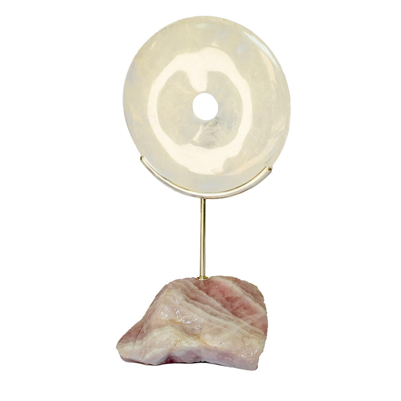 This astonishing Pi disk is inspired by the ancient Chinese tradition, representing eternity, the sun and sky, and courage and honor. The carved piece features as flat, clear quartz crystal disk with a circular hole in the center, a slender