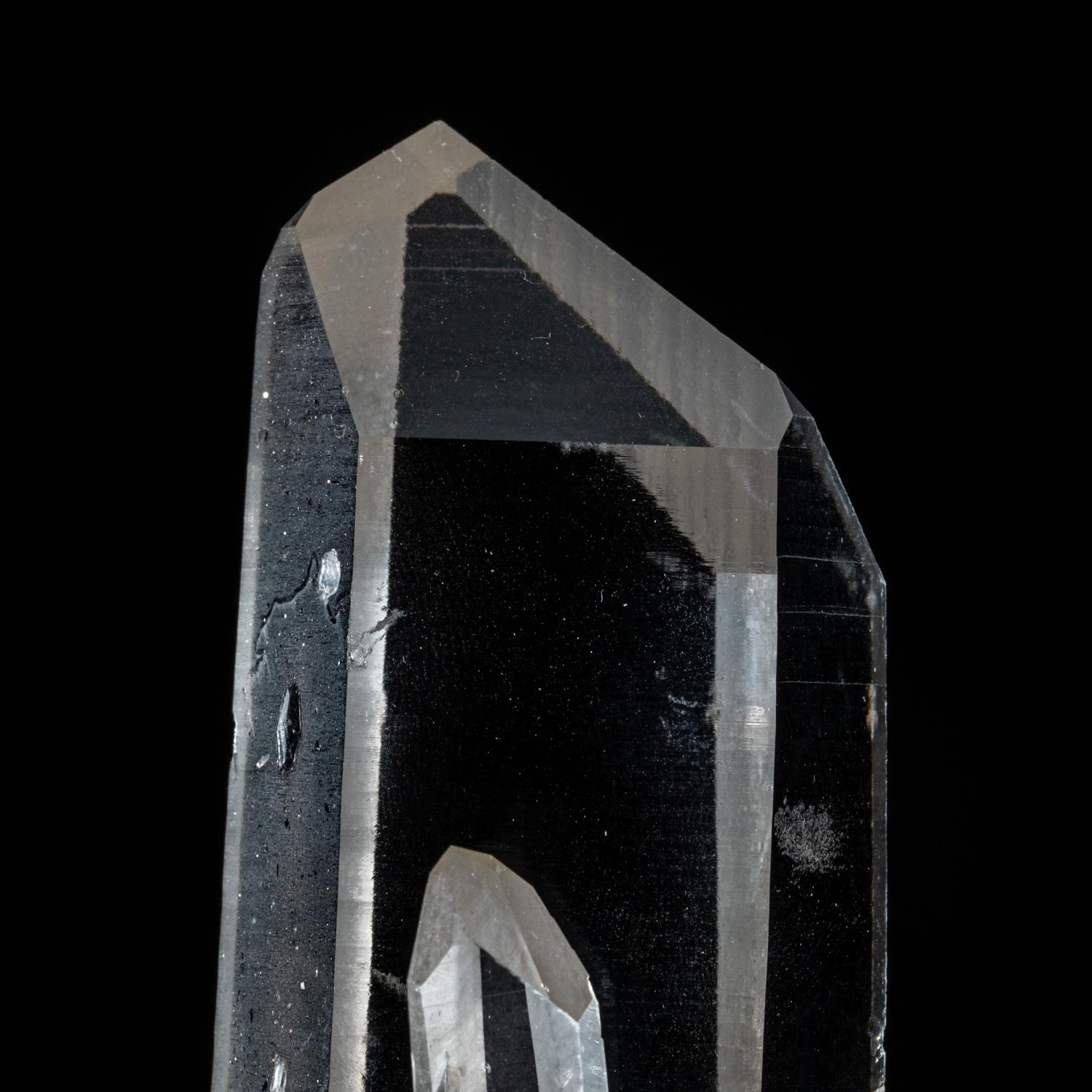 From Diamantina, Minas Gerais, Brazil

Large transparent colorless quartz crystals with surfaces composed of many smaller parallel crystal faces. Internally the quartz id highly transparent with scattered flaws.

 You will receive the exact object