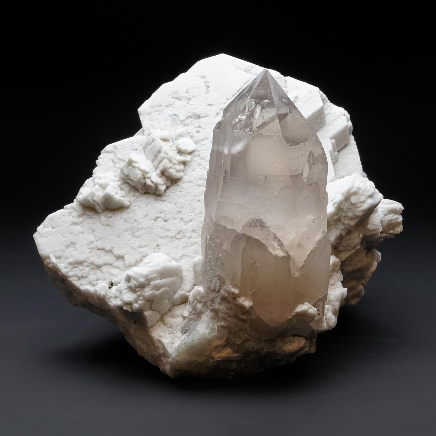 Huge, museum-quality, Himalayan quartz generator crystal, sitting on a large, white Feldspar crystal, both perfectly terminated with top luster. This piece is a magnificent combination of rare quartz specimens - found at an elevation of 8000 meters