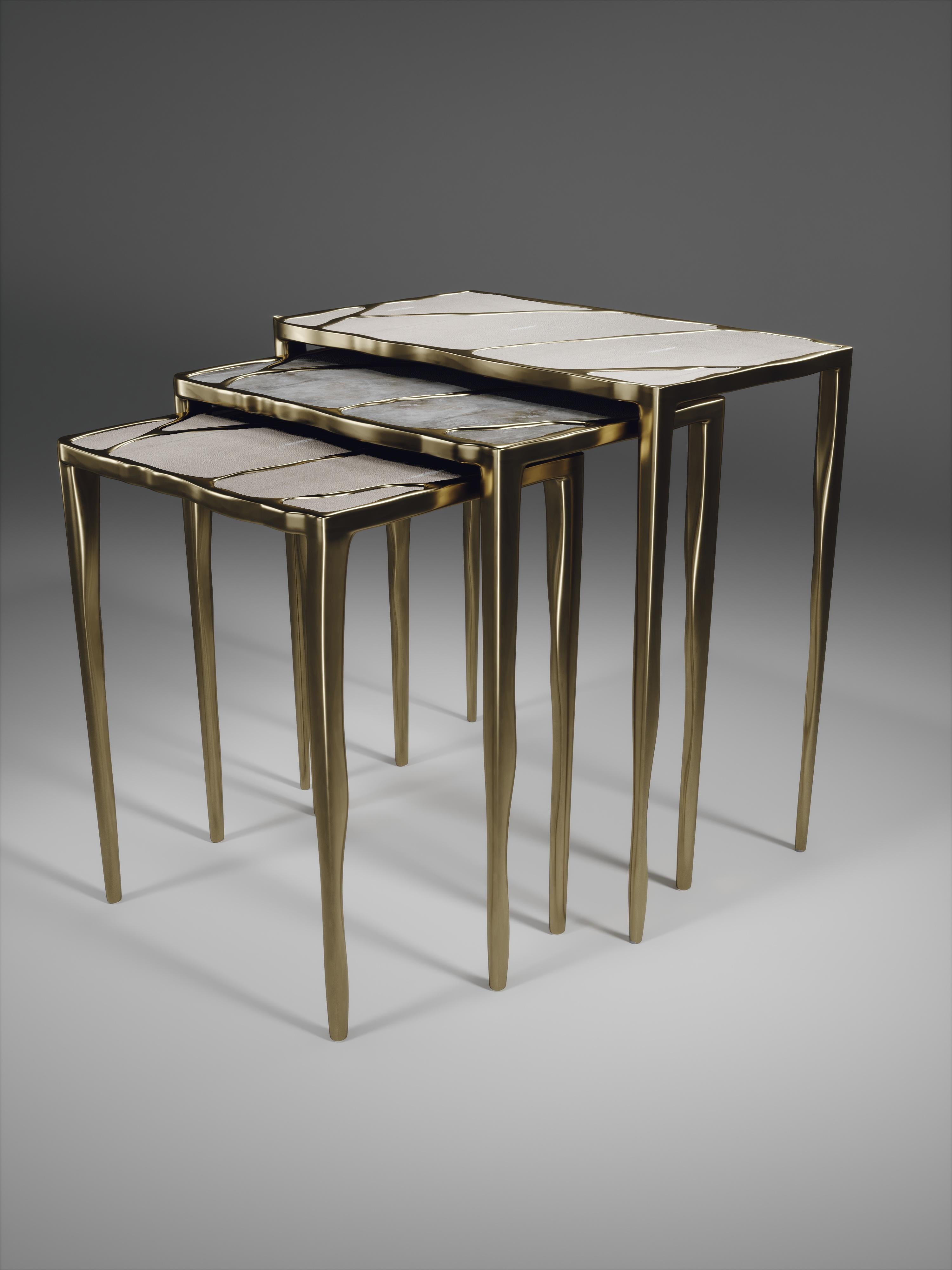 The Melting II nesting side table medium, is the perfect accent piece for any living space. These are sold either as a set of 3 to create elegant and geometric shapes, or individually. This listing is for the medium size only. The top is inlaid in