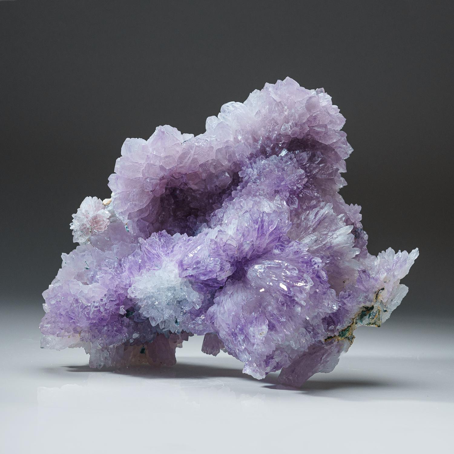 Quartz var. Amethyst flower from Rio Grande do Sul, Brazil.

Aesthetic formation of lustrous transparent purple amethyst quartz crystals in fan-shaped aggregate. These formations are commonly called Amethyst Flowers because they resemble a