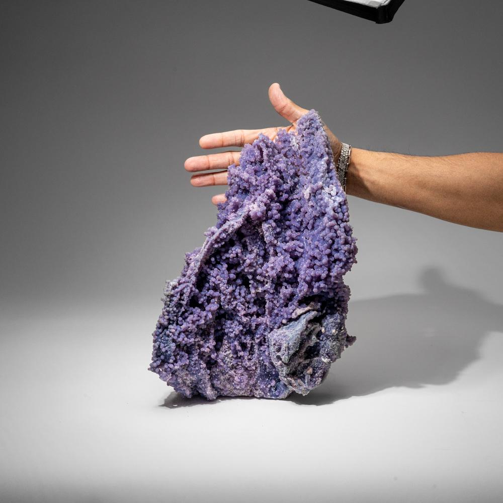 From near Pantai Manakarra, Mamuju, Sulawesi, Indonesia

Double-sided cluster of translucent grape purple quartz agate in spherical formations with a radial internal structure and are found in cavities in pillow basalt. Also known as Grape