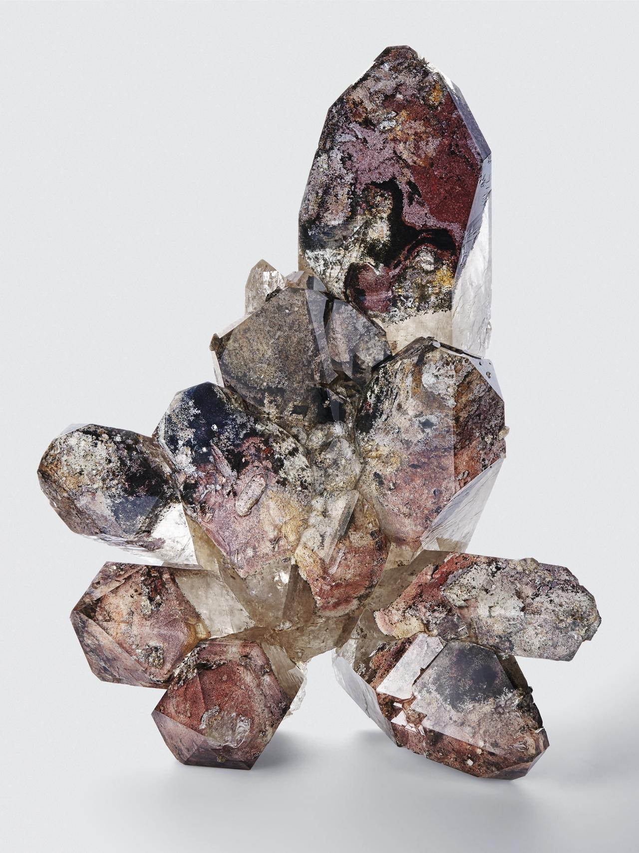 One of our specialties is inclusions. We have handled many of the world's finest known examples. I have never seen anything like this before. Normally you would find a single crystal like this, never a cluster, and never this large. The colors of