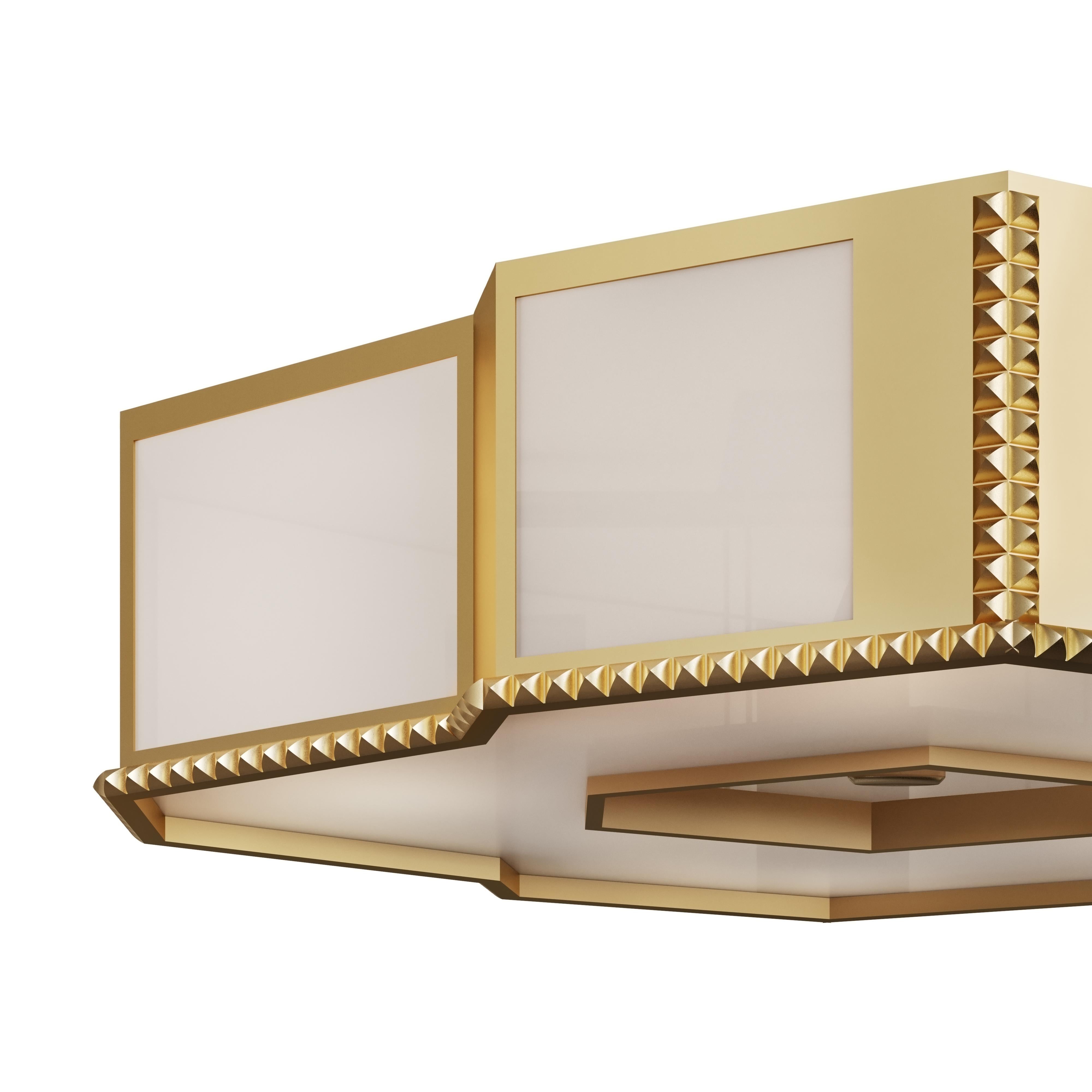 A brass and transparent white lucite flush mounted light fixture with cast nailhead trim and removable section on underside and lightly antiqued brass finish. Alternate finishes available. Made by David Duncan Studio, New York.
    