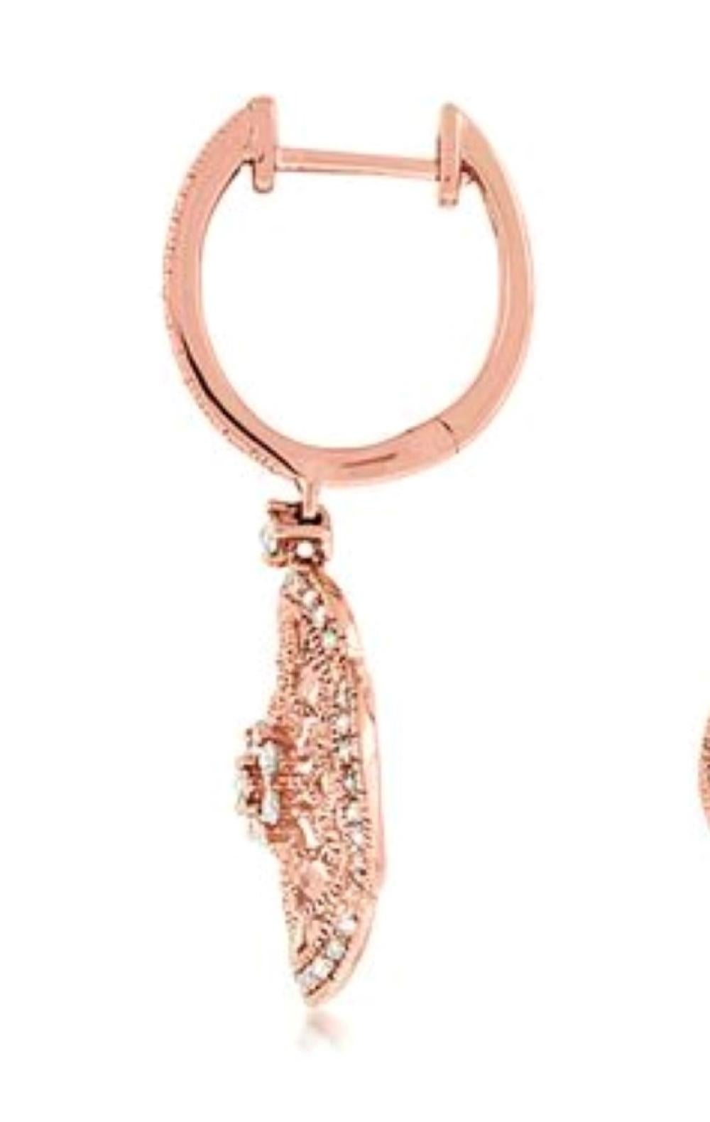 These elegant rose gold drops proudly display .52 carats total weight of round brilliant cut diamonds and delicate filigree work crafted from fine 14 karat rose gold.