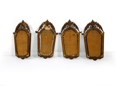 Quattro appliques in noce e legno dorato, inizi XIX secolo