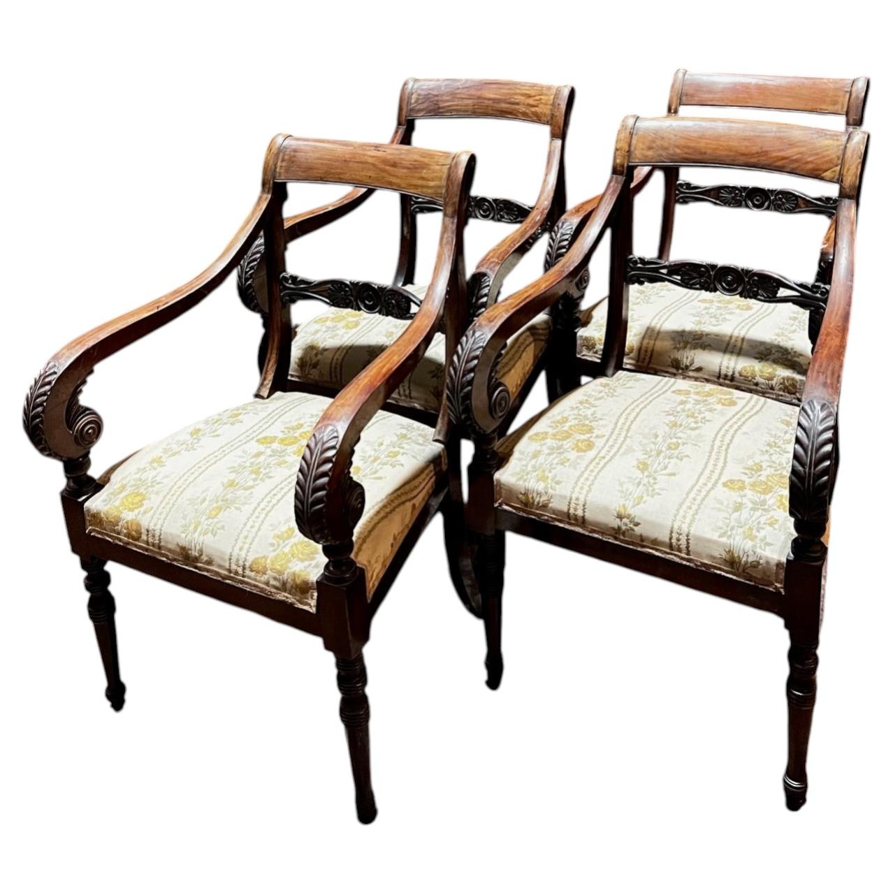 Four carved walnut armchairs with arms, Italy For Sale