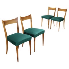 Cuatro sillas de los años 50 con asientos verdes