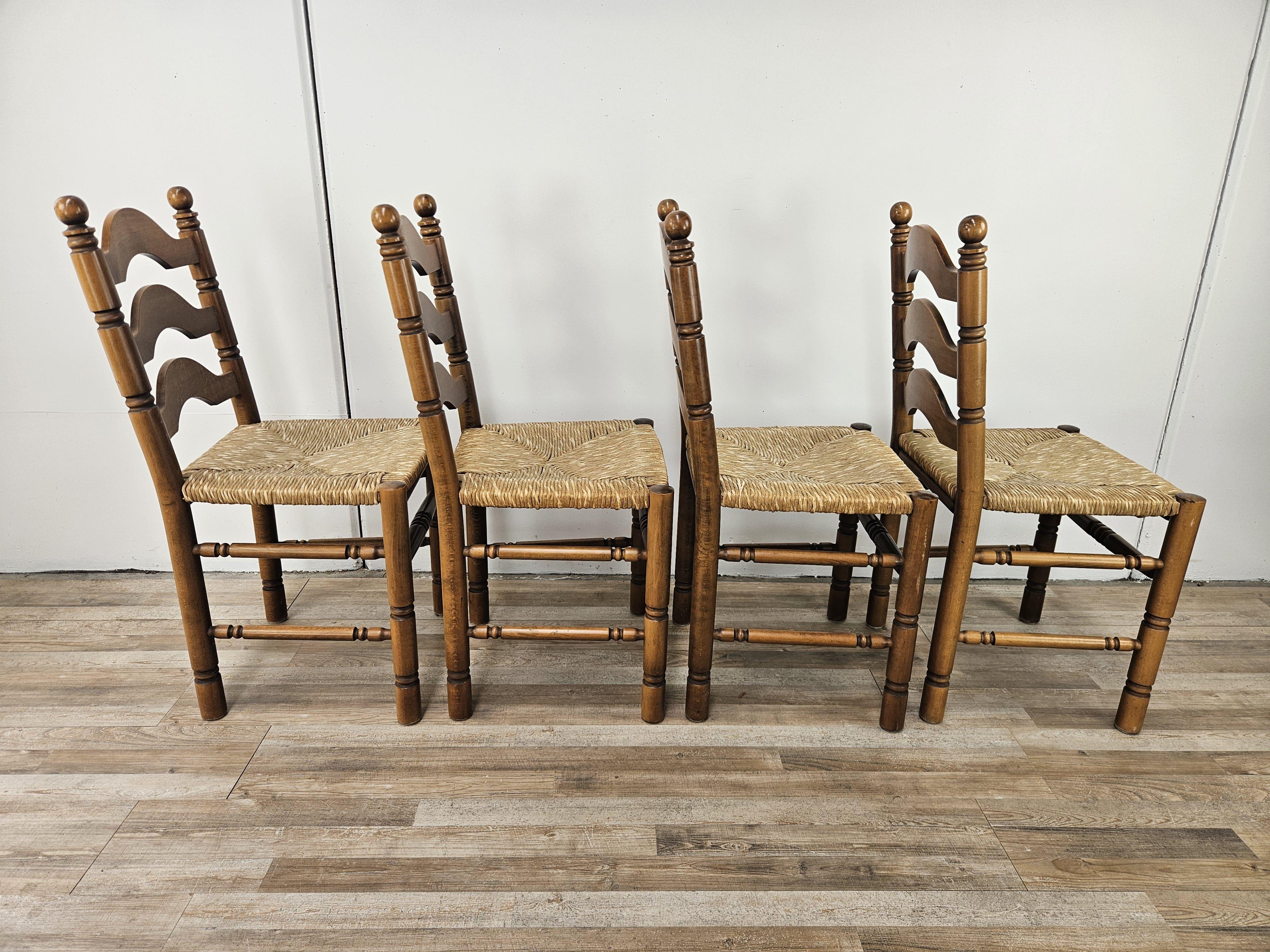 Four solid, sturdy chairs dating from about 1980, made of solid wood with woven straw seats.

Suitable for a rustic or country style dining room.