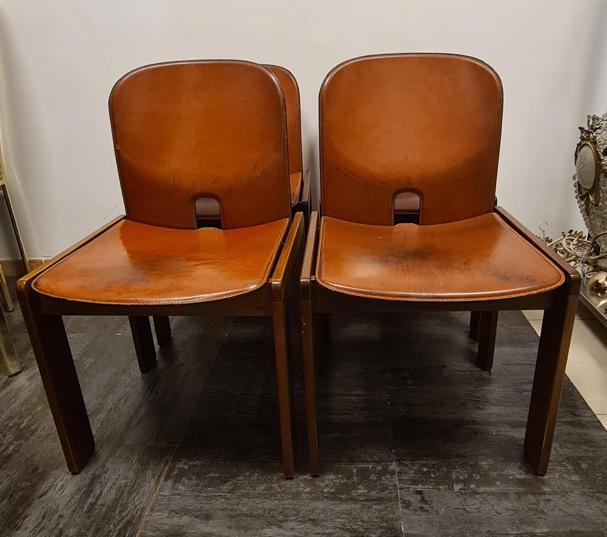 Chairs model 121 by Cassina designed by Afra and Tobia Scarpa.

Four chairs with rosewood frame and leather-covered wooden seat and back.

Iconic chairs designed in 1965.

Afra Bianchin and Tobia Scarpa are one of the most famous pairs of Designers