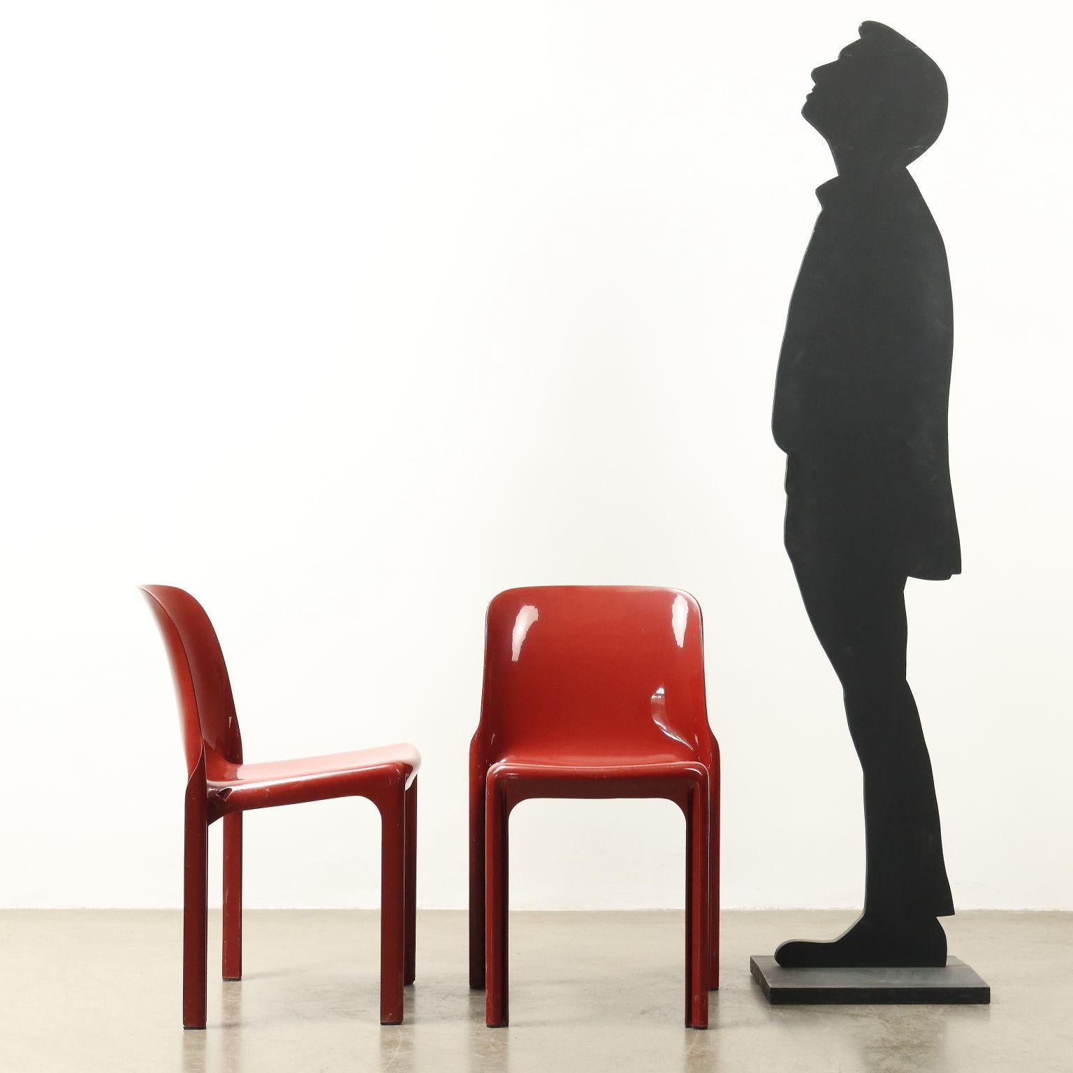 Set of red plastic chairs designed by Vico Magistretti and produced by Artemide in the 1970s.  