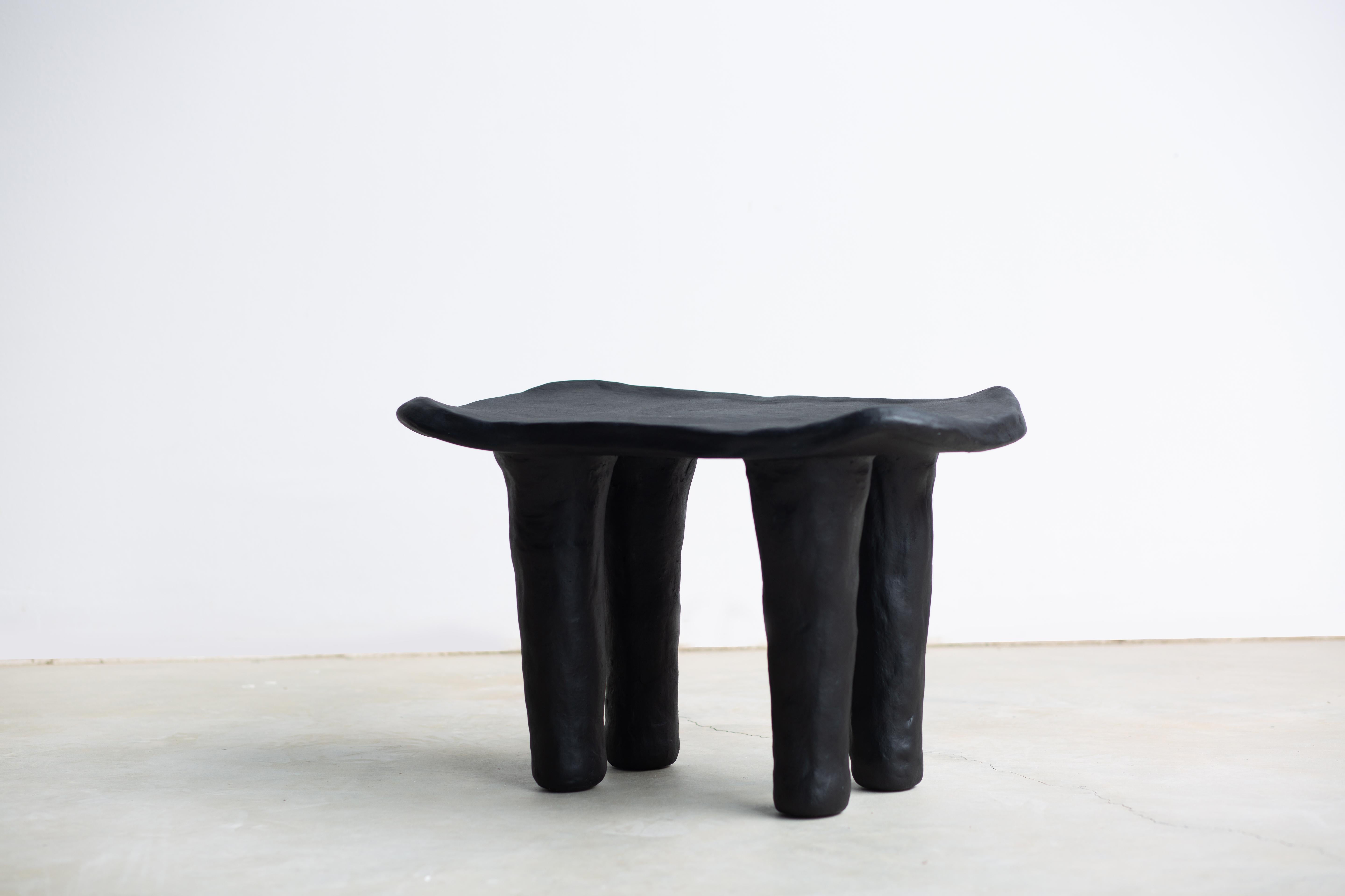Quattuor Stool by Isin Sezgi Avci
Unique Piece.
Dimensions: D 54 x W 33 x H 38 cm.
Materials: Hand-built ceramic.

Quattuor is a piece of ceramic sculptural furniture. The form’s simplicity is created by hand and brush strokes that keep its heavy