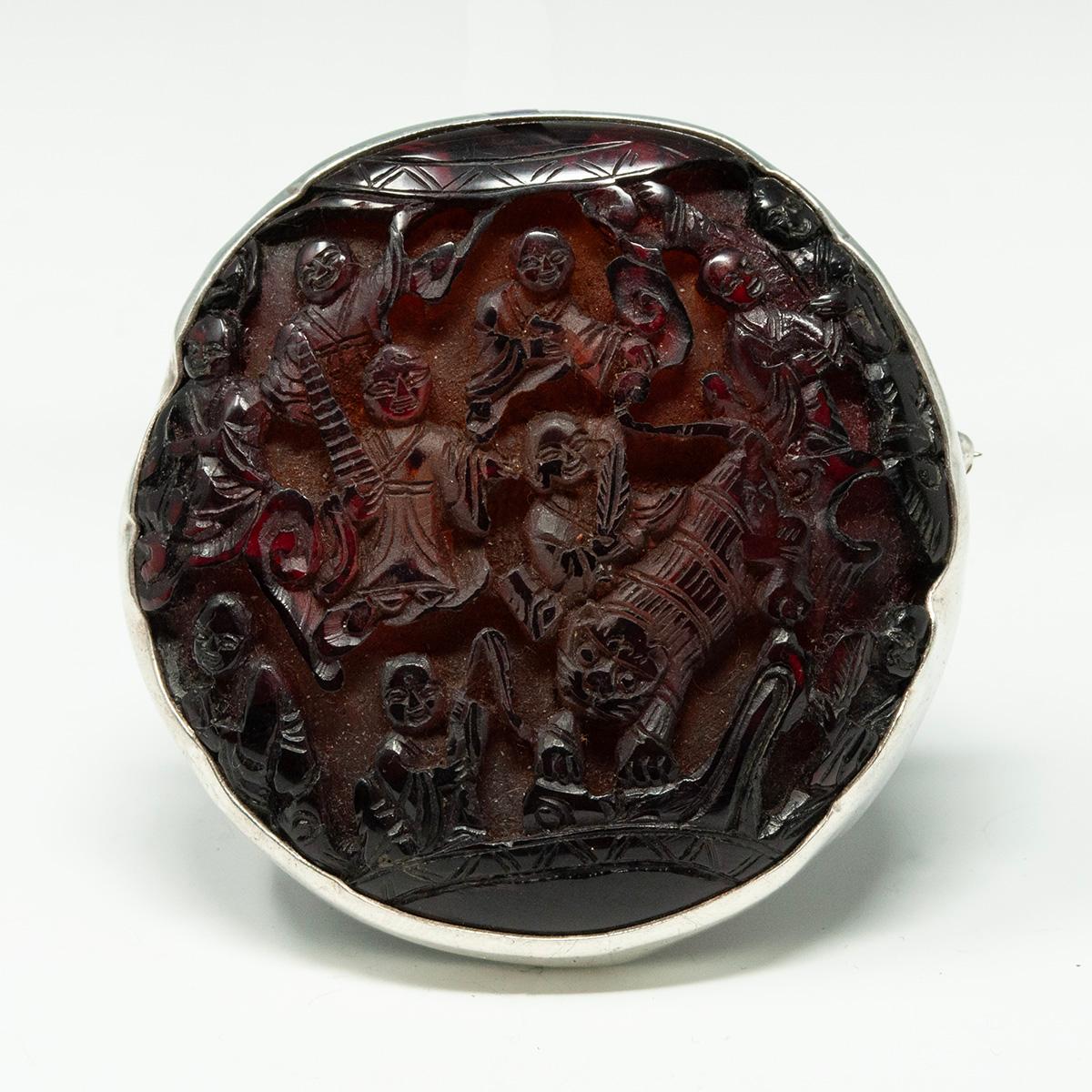 Coreen Cordova Que Milagros Silver and Cinnabar Brooch

A wonderful carved cinnabar brooch by Coreen Cordova of Que Milagros jewelry. It measures 2.25 inches in diameter and is .5 inch thick; it weighs 37.4 grams. There is a pin on the back and Que