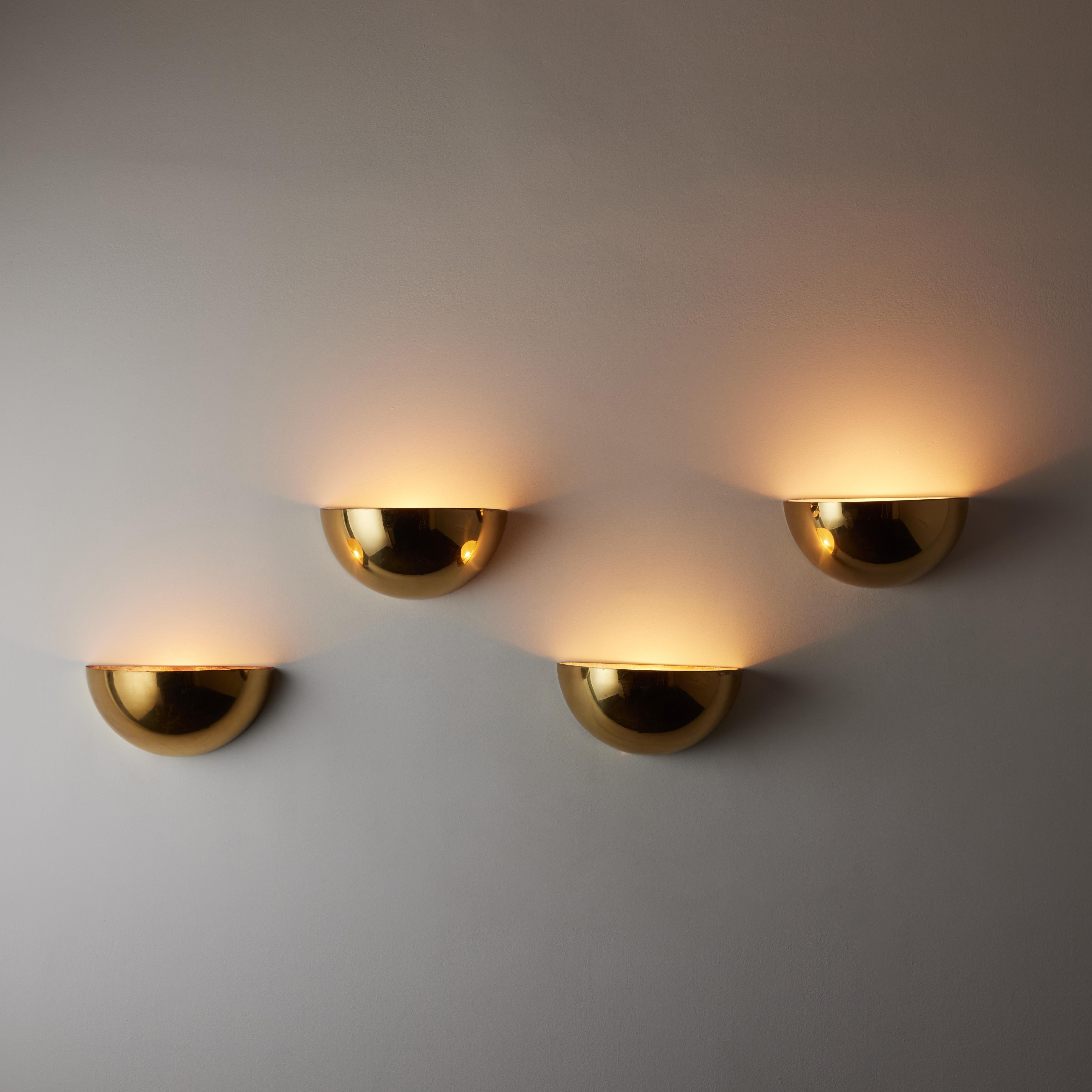 'Quebec' Sconces by Gilla Giani for Tronconi. Designed and manufactured in Italy, circa the 1980s. Half Dome shells in a beautifully aged polished brass. Each sconce holds a single E27 socket type, adapted for the US. We recommend a 40-60w max bulb