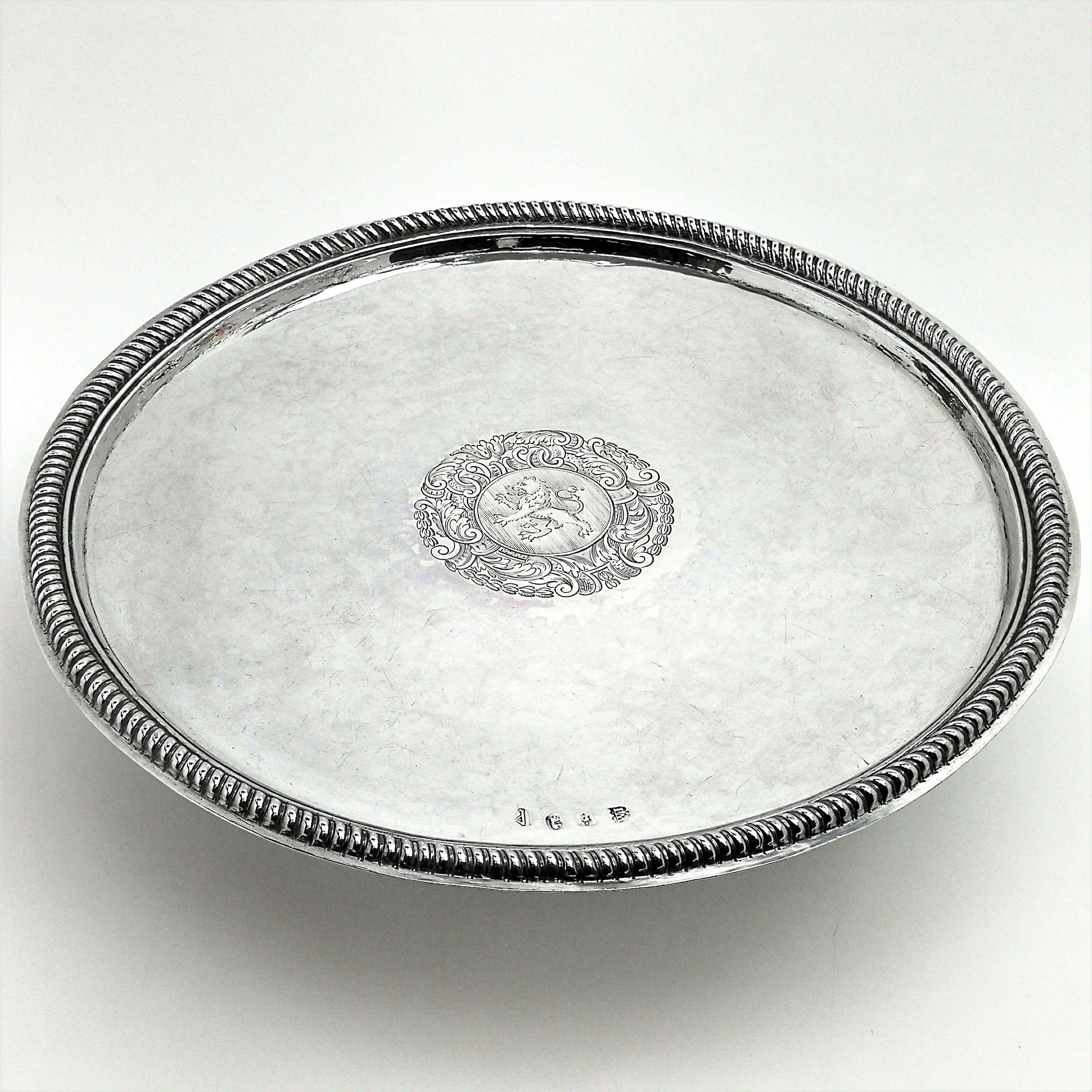 A magnificent Queen Anne solid silver tazza with an engraved crest in the centre. The rim of this antique tazza is embellished with a chased gadroon edge and the spread foot has a chased fluted design.
 
 Made in London in 1706 by John Wisdome.
 
