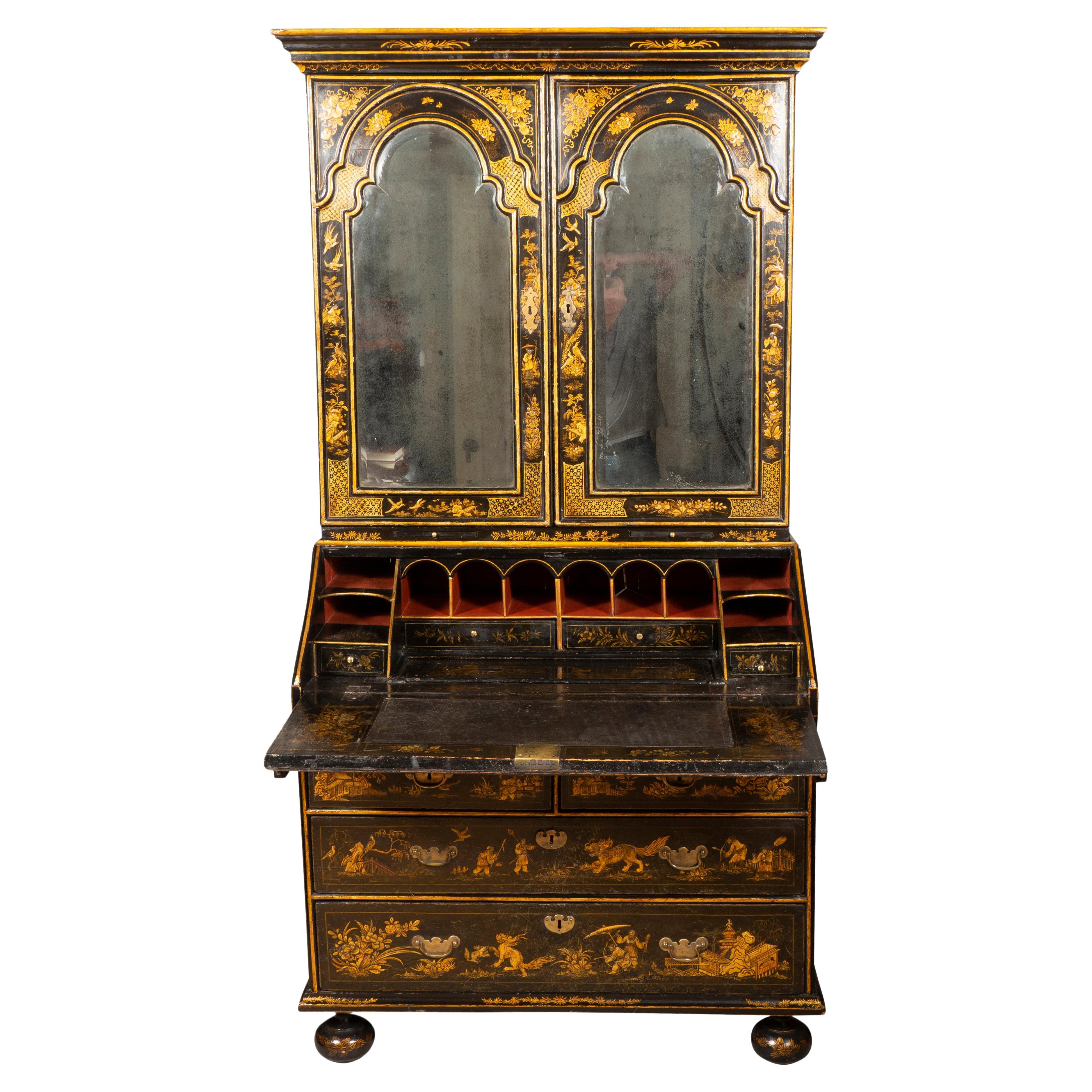 A beautiful piece reputedly purchased by the previous owner from Kentshire Antiques in New York for 185,000 in the 1980s. With flat top over a pair of beveled mirror doors enclosing shelves and cubby holes and drawers, the base with a slant lid