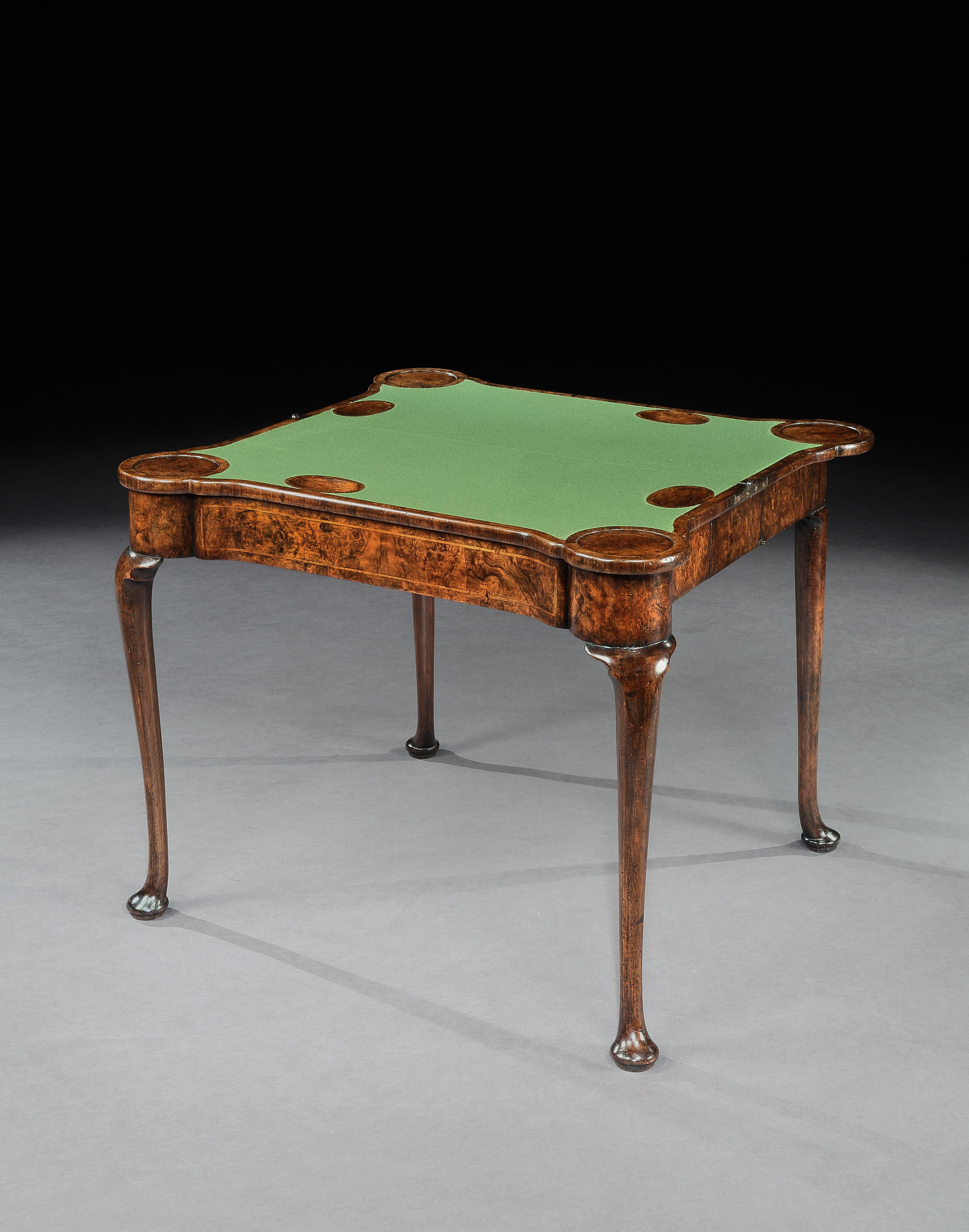 A rare Queen Anne burr walnut concertina card table, the quartered top inlaid with feather bandings, the interior also veneered in burr walnut and inlaid with feather bandings.

English, circa 1710.

This table bears many of the characteristics