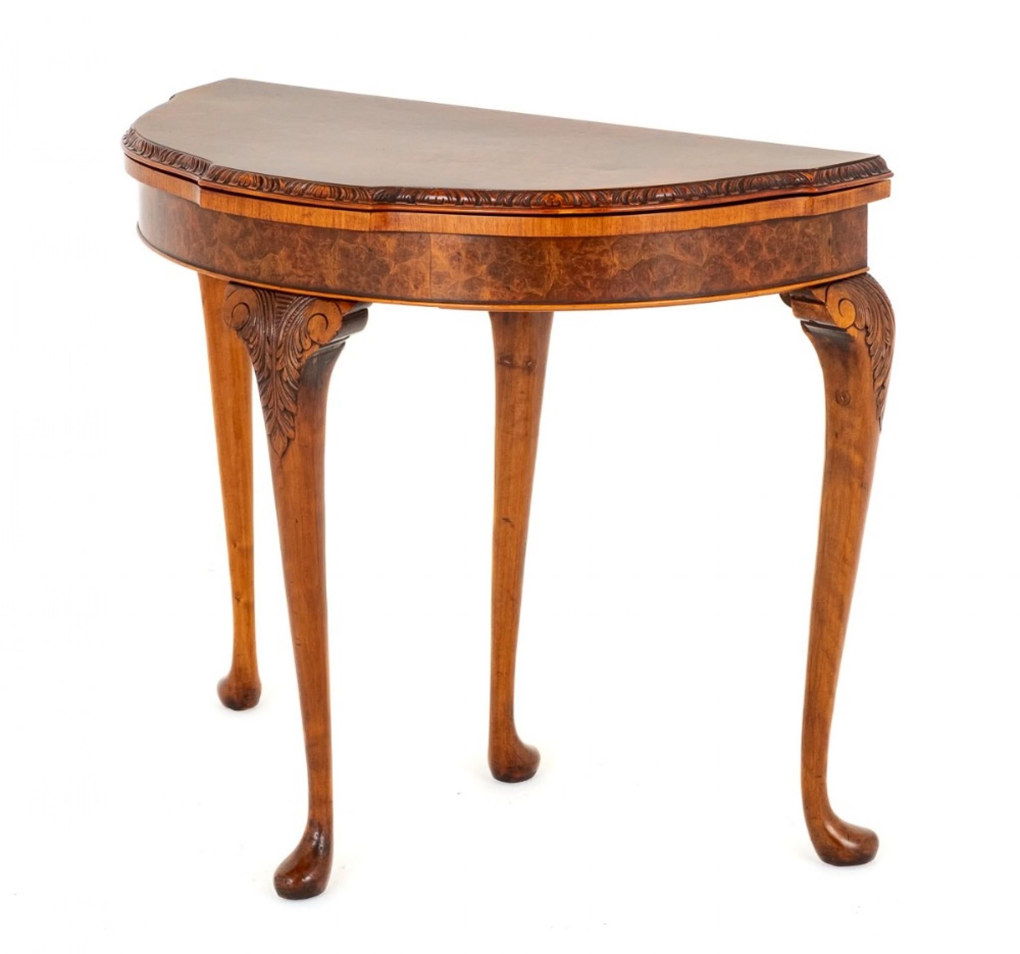 Burr Walnut Queen Anne Style Card Table.
Circa 1920
This Card Table is Raised Upon Shaped Legs With Carved Knees and Pad Feet.
The Frieze and Top of the Table Featuring The Best Quality Burr Walnut Veneers.
The Rear Leg Pulls out to Reveal a Drawer