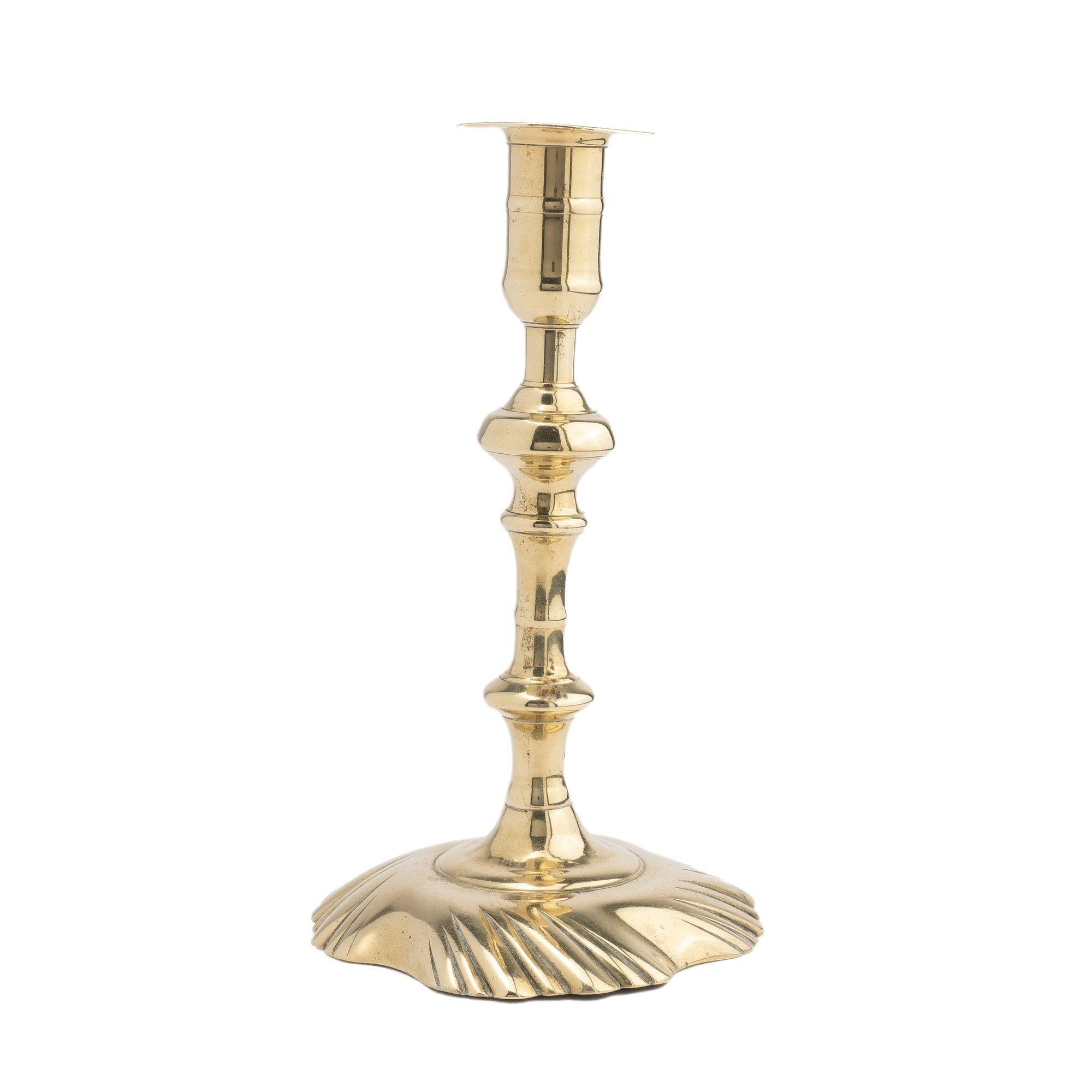 British Queen Anne cast brass swirl base candlestick, 1750-75 For Sale