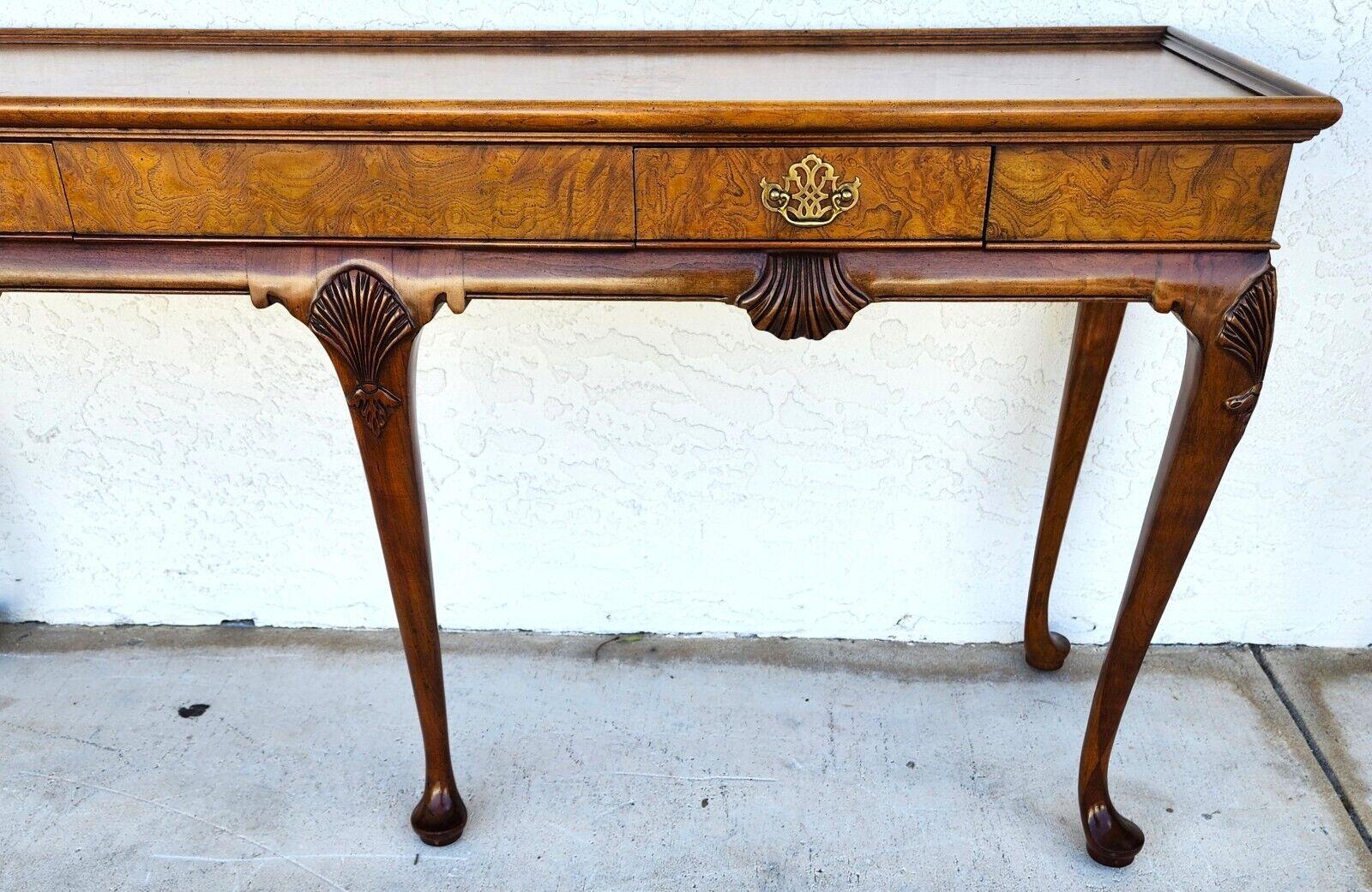 For FULL item description click on CONTINUE READING at the bottom of this page.

Offering One Of Our Recent Palm Beach Estate Fine Furniture Acquisitions Of A
Gorgeous Queen Anne style console or sofa table by Baker Furniture
USA, Circa 1980s
Carved