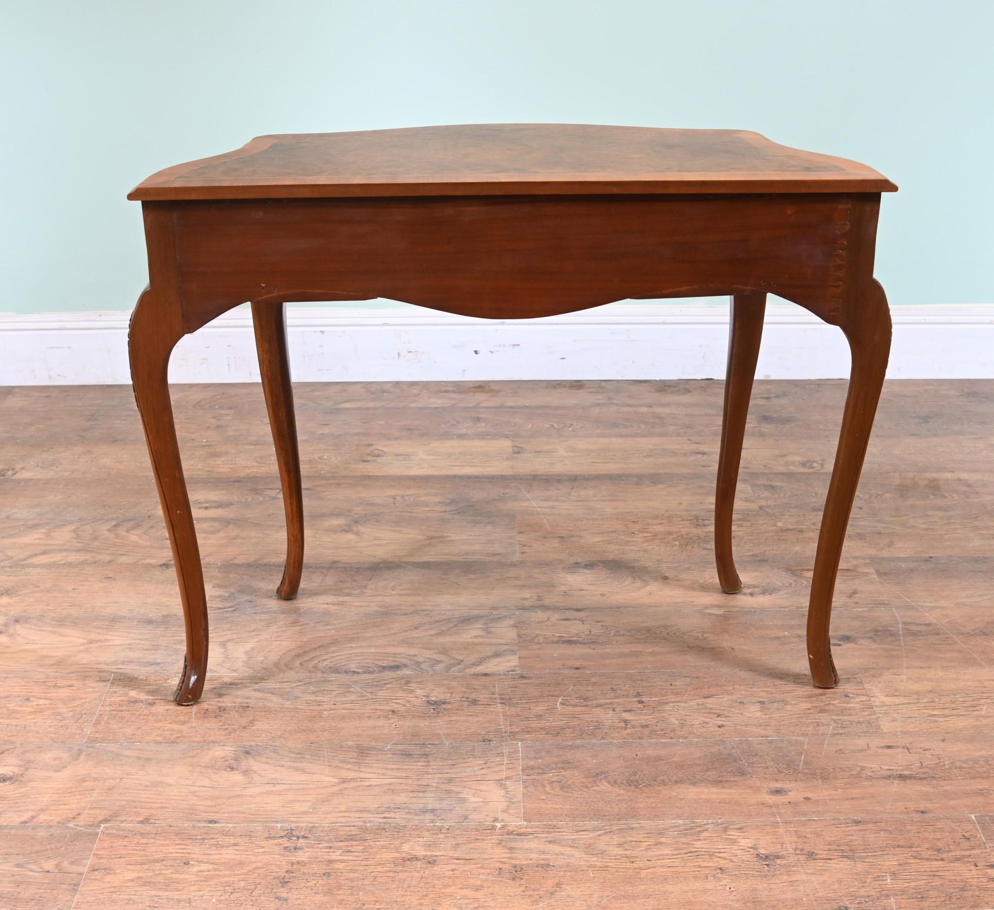A Queen Anne style side table or server in burr walnut with satinwood crossbanding around the
top and drawer front
Clean and minimal design perfect for modern interiors
This item is by Epstein and Co of East London
Circa 1930
Epstein & Co. was a