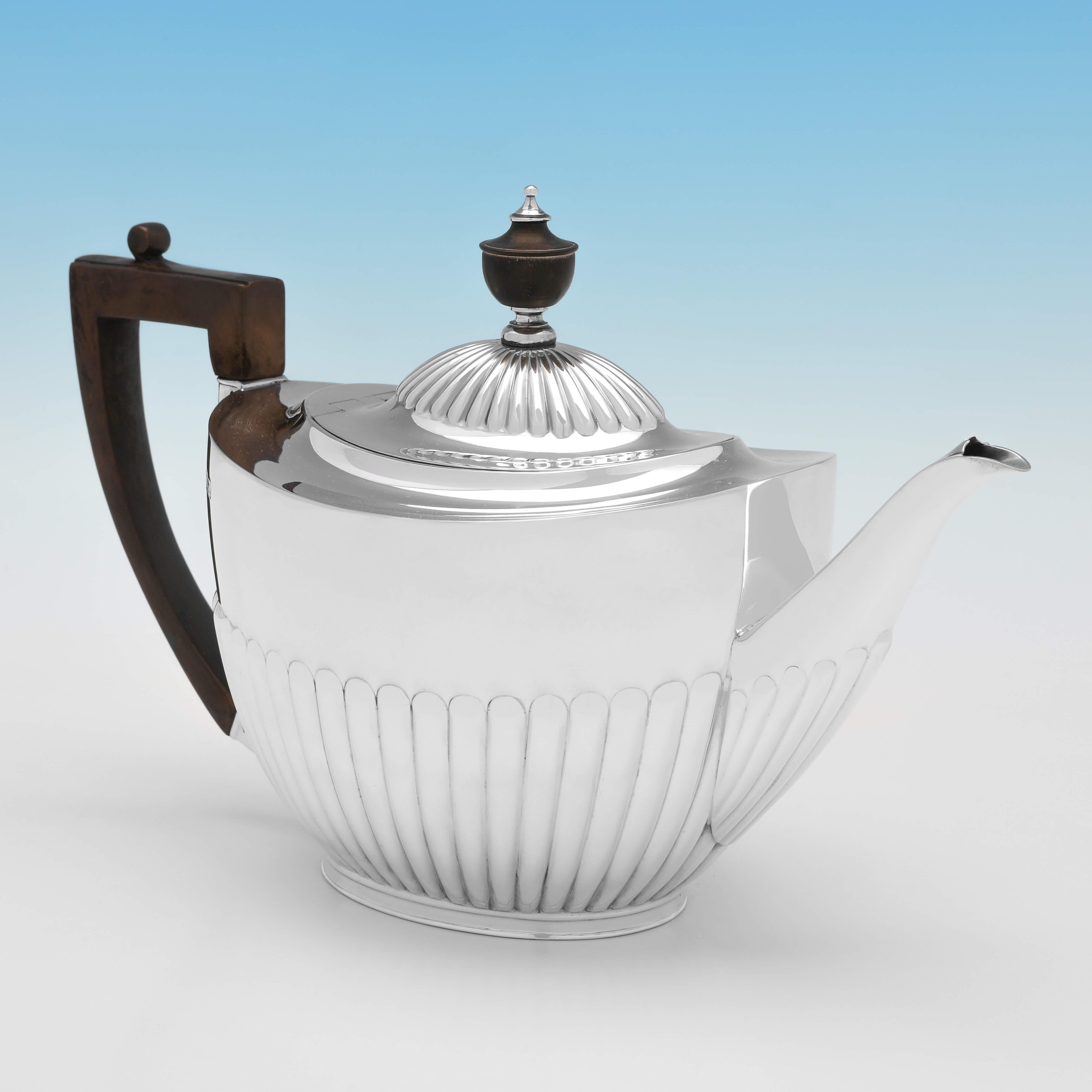 Hallmarked in Sheffield in 1893 by Roberts and Belk, this charming, Victorian, Antique Sterling Silver Teapot is in the Queen Anne style. 

The teapot measures 6