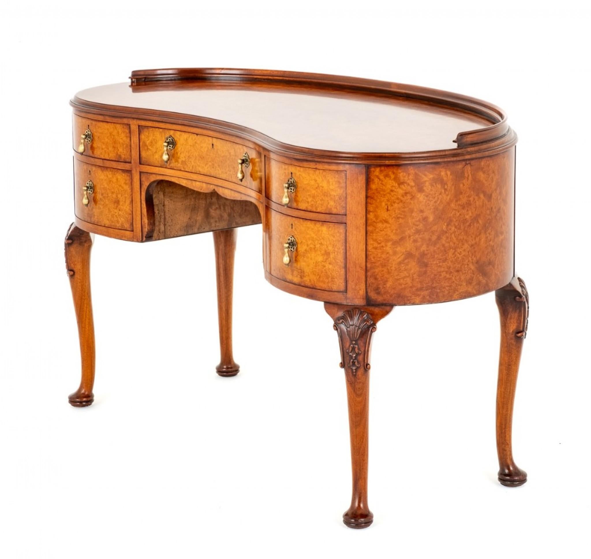 Here We Have a Good Quality Dressing Table of a Kidney Shape Form - would also function as a good desk
Standing Upon Cabriole Legs with Pad Feet and Carved Shells to the Knees.
Featuring 5 mahogany Lined Drawers with Pretty Brass Drop Handles.
The