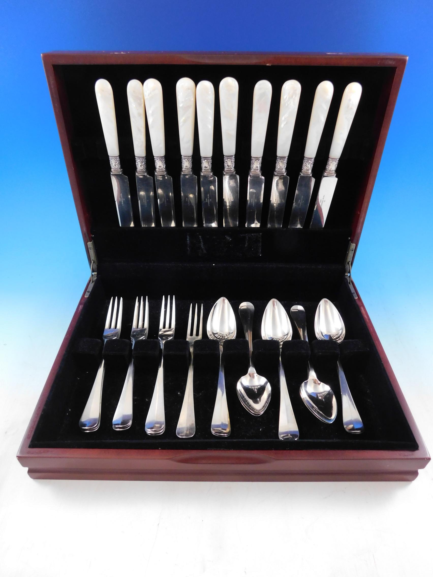 Queen Anne Dutch .833 silver dessert flatware set, 20 pieces plus 10 Mother of Pearl handle knives with sterling ferrules. This set includes:

10 knives w/ mother of pearl handles, 8 5/8