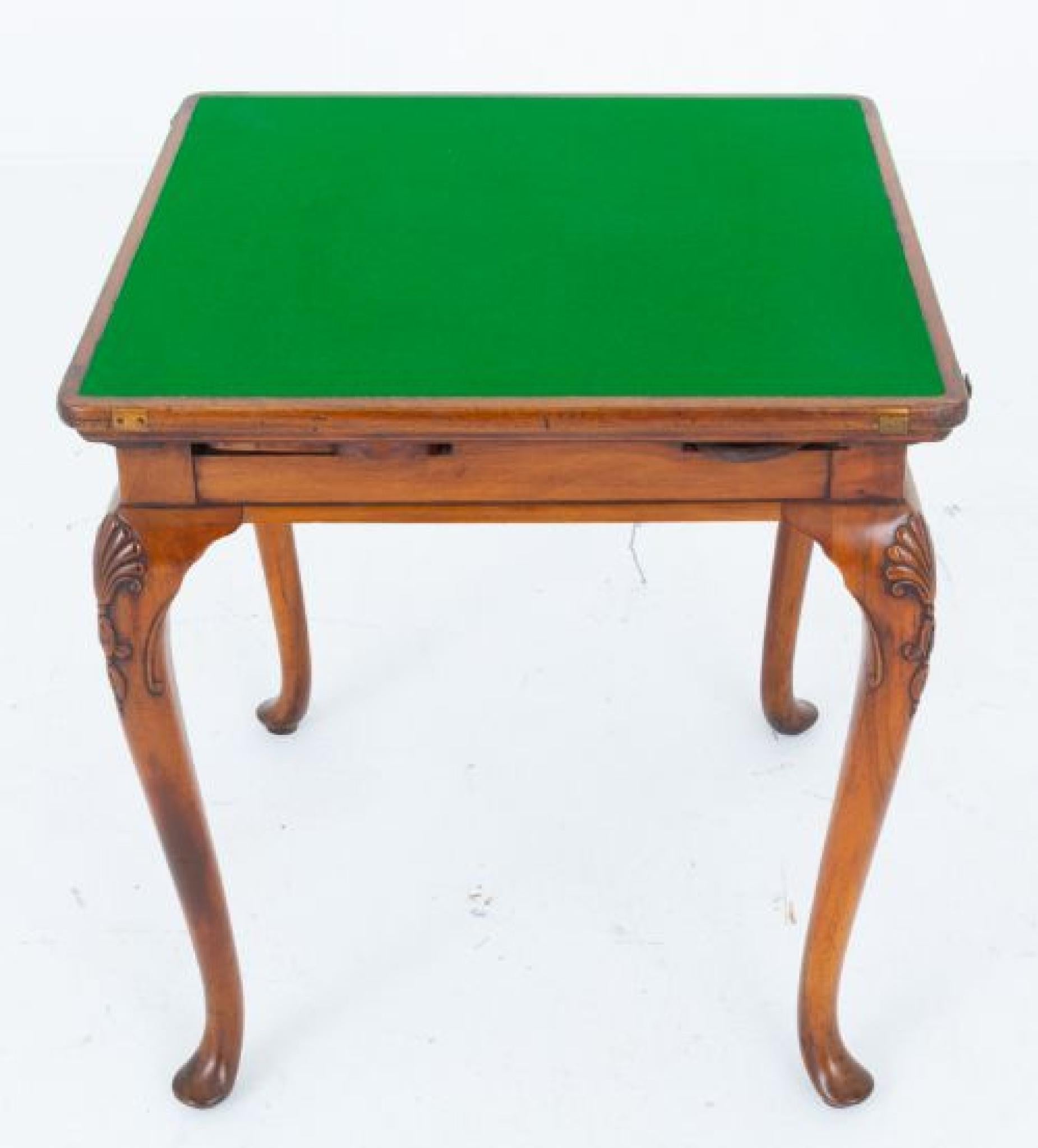 A rather unusual Queen Anne style games table
This games table is raised upon cabriole legs with pad feet and carved shells to the knees
Circa 1900
The green leather top of the table (replacement) featuring hand applied gilt and blind tooling can be