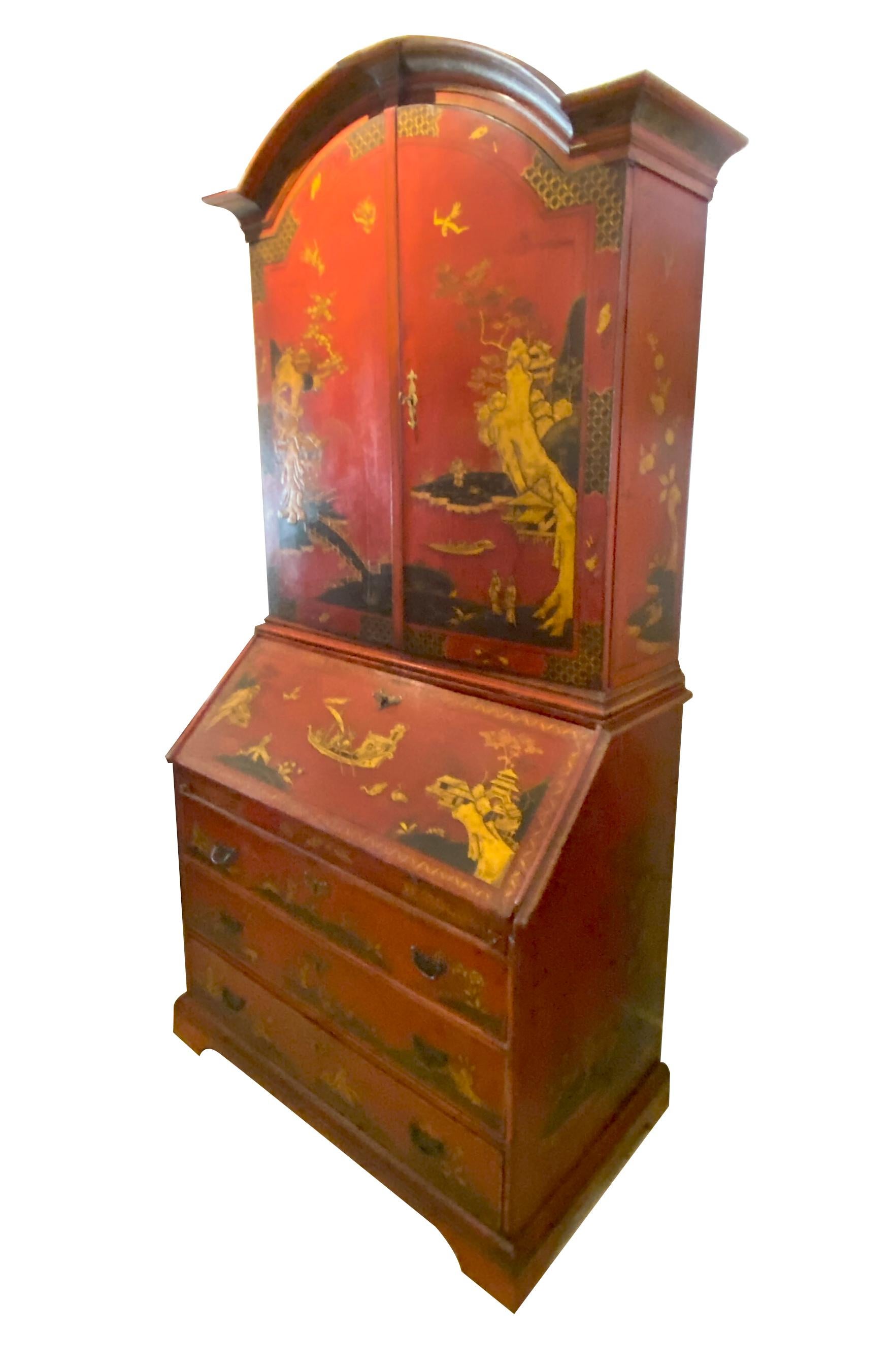 Likely Dutch. With arched cornice over a pair of arched doors opening to shelves and drawers, the base with hinged slant lid writing surface opening to a fitted compartment with drawers and cubbyholes over three drawers raised on bracket feet.