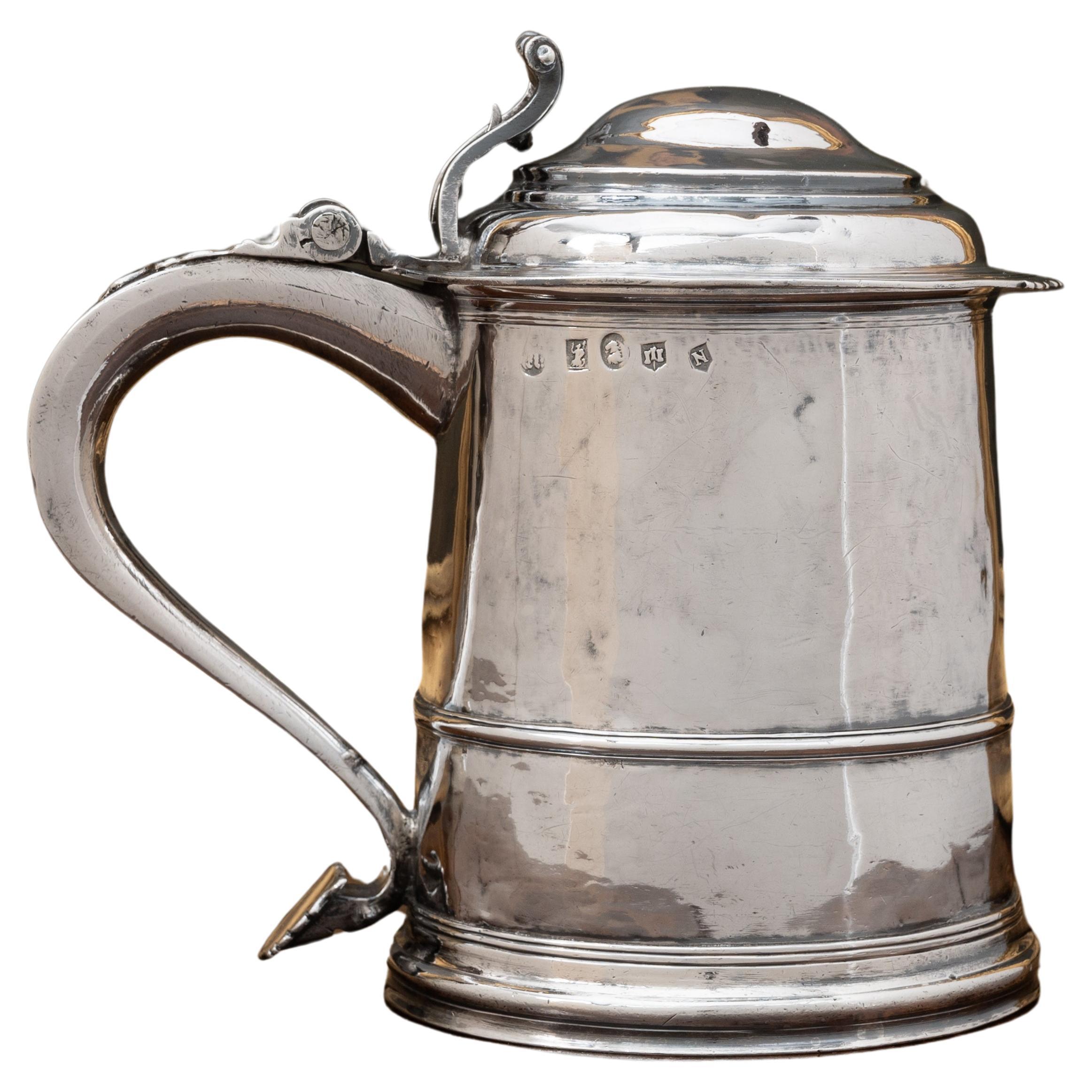 A Queen Anne provincial Britannia standard silver tankard, Exeter 1713 by John Elston I. 

Fully marked to the body with the figure of Britannia and lion head erased; castle with three turrets in shield for Exeter; N, Exeter date letter for 1713;